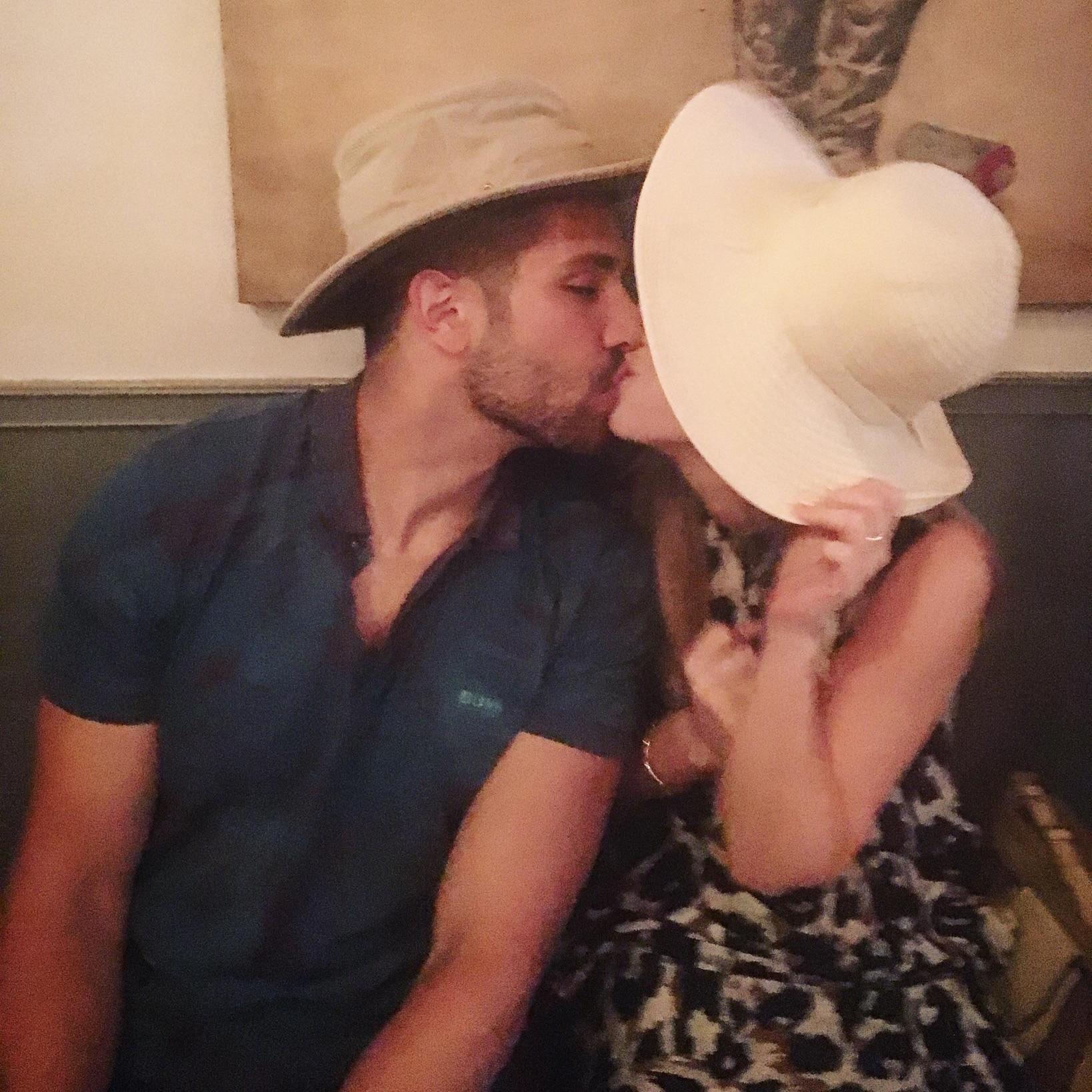 Sneaking a smooch in at the engagement brunch.