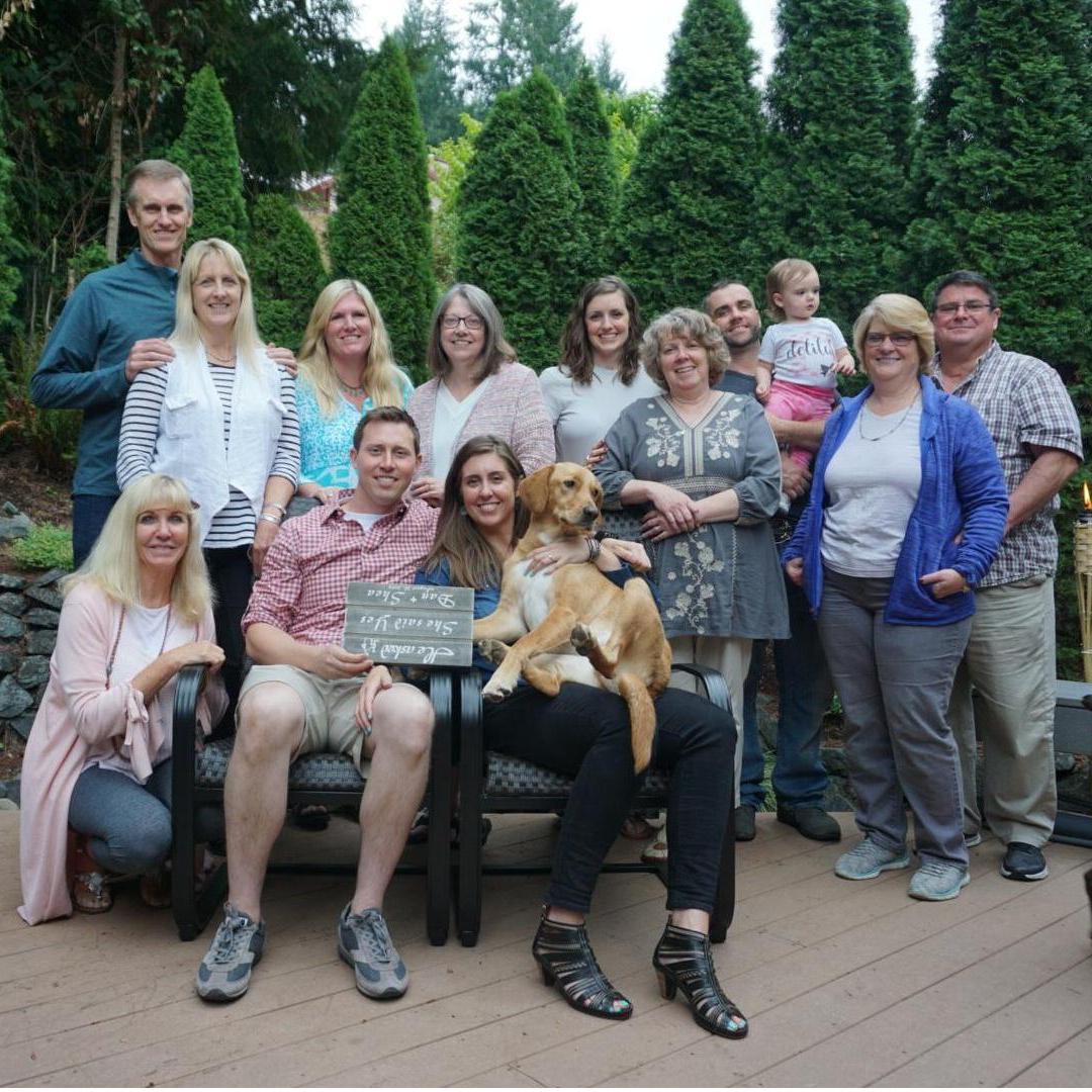 The sign is upside down but the sentiment is the same: He asked, she said yes! Thank you family for being a part of this special day!