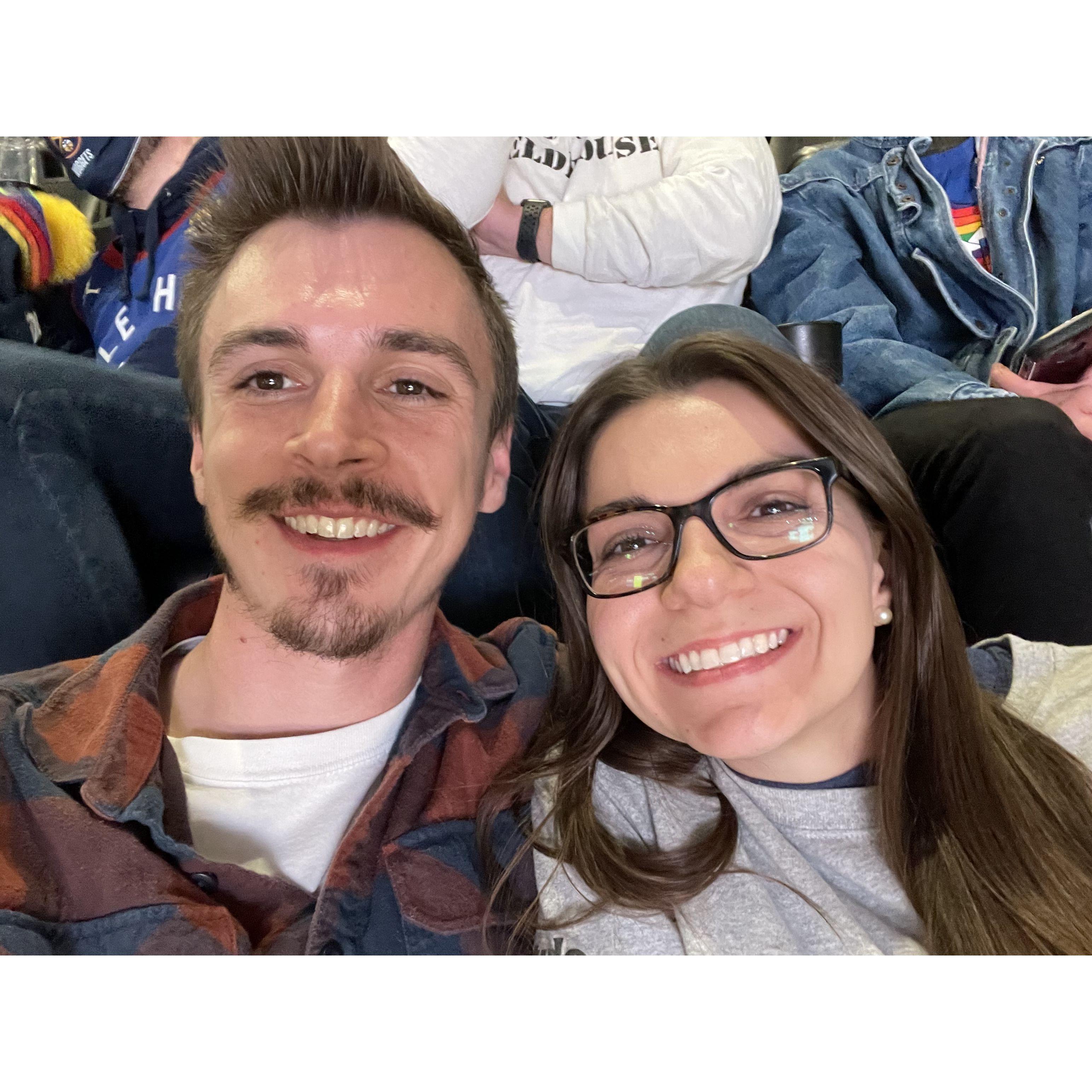 Our first photo together at a Denver Nuggets game on Black Friday 2021