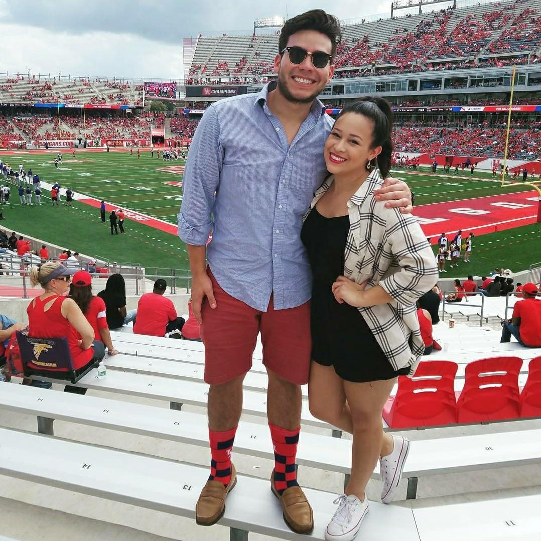 At a beloved UH football game watching our Coogs battle it out on the field!