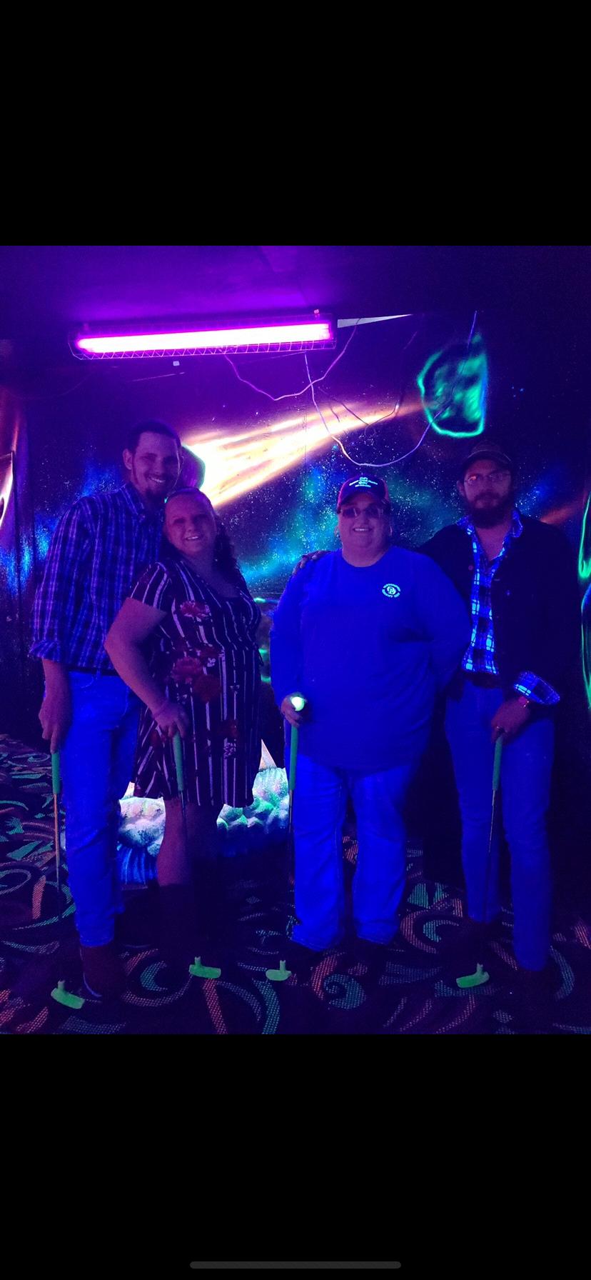Black light mini golf with Johnny and Caitlin