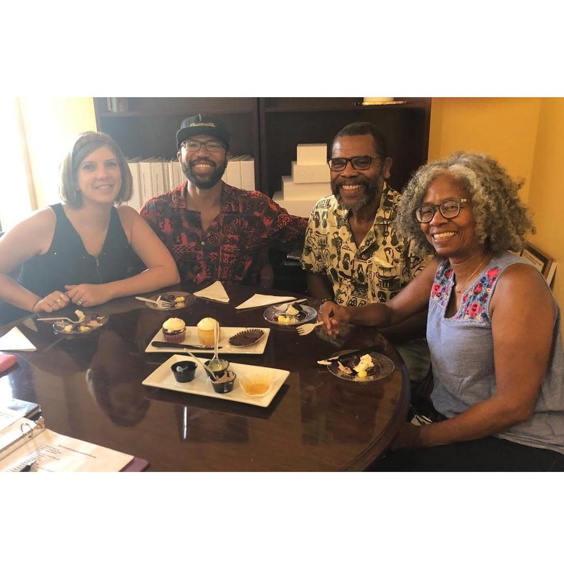 Katy, Alex, Curtis, and Diane getting excited for wedding planning during a cake tasting!