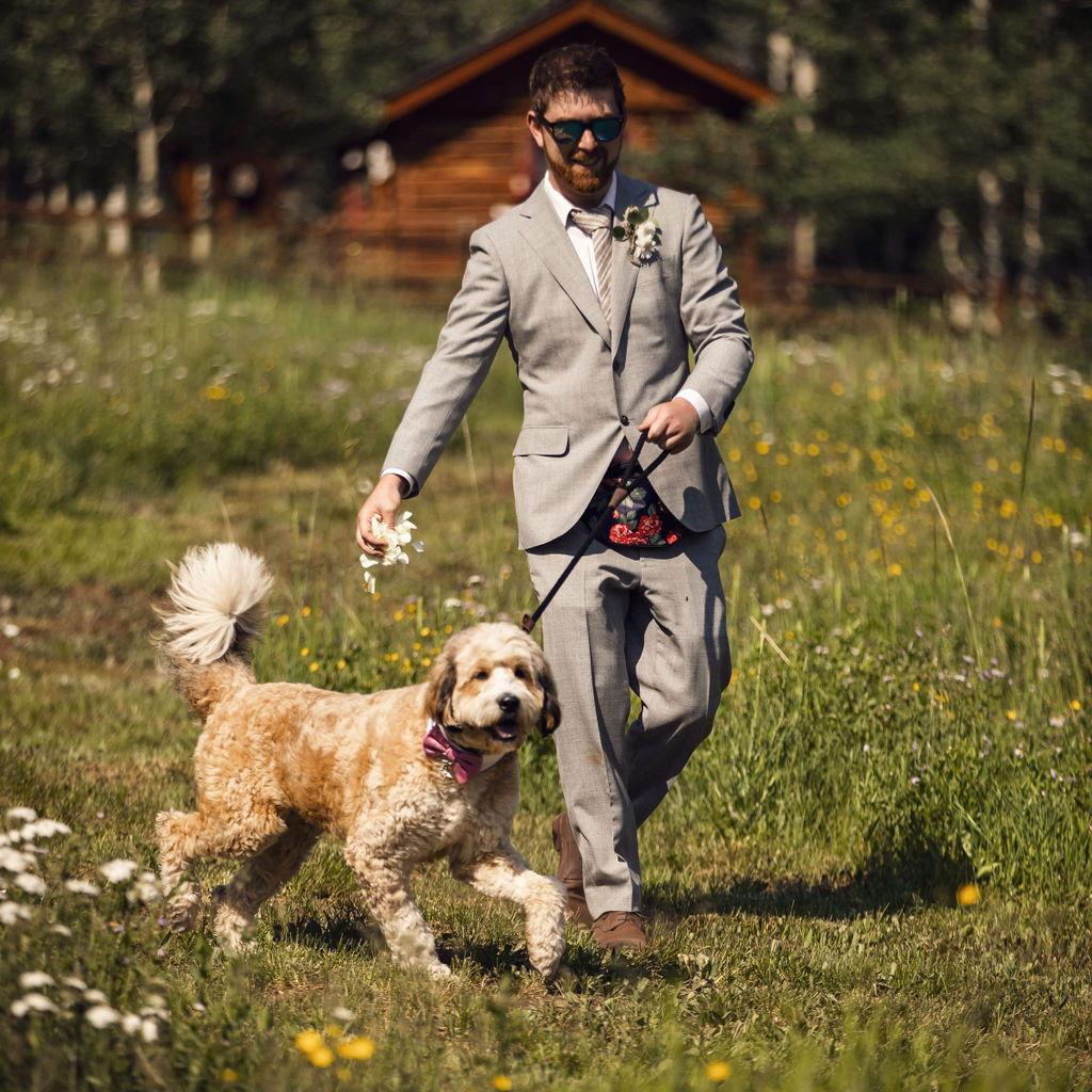 Ryan was the Flower Man at his sister's wedding. Bosco is her doggo.