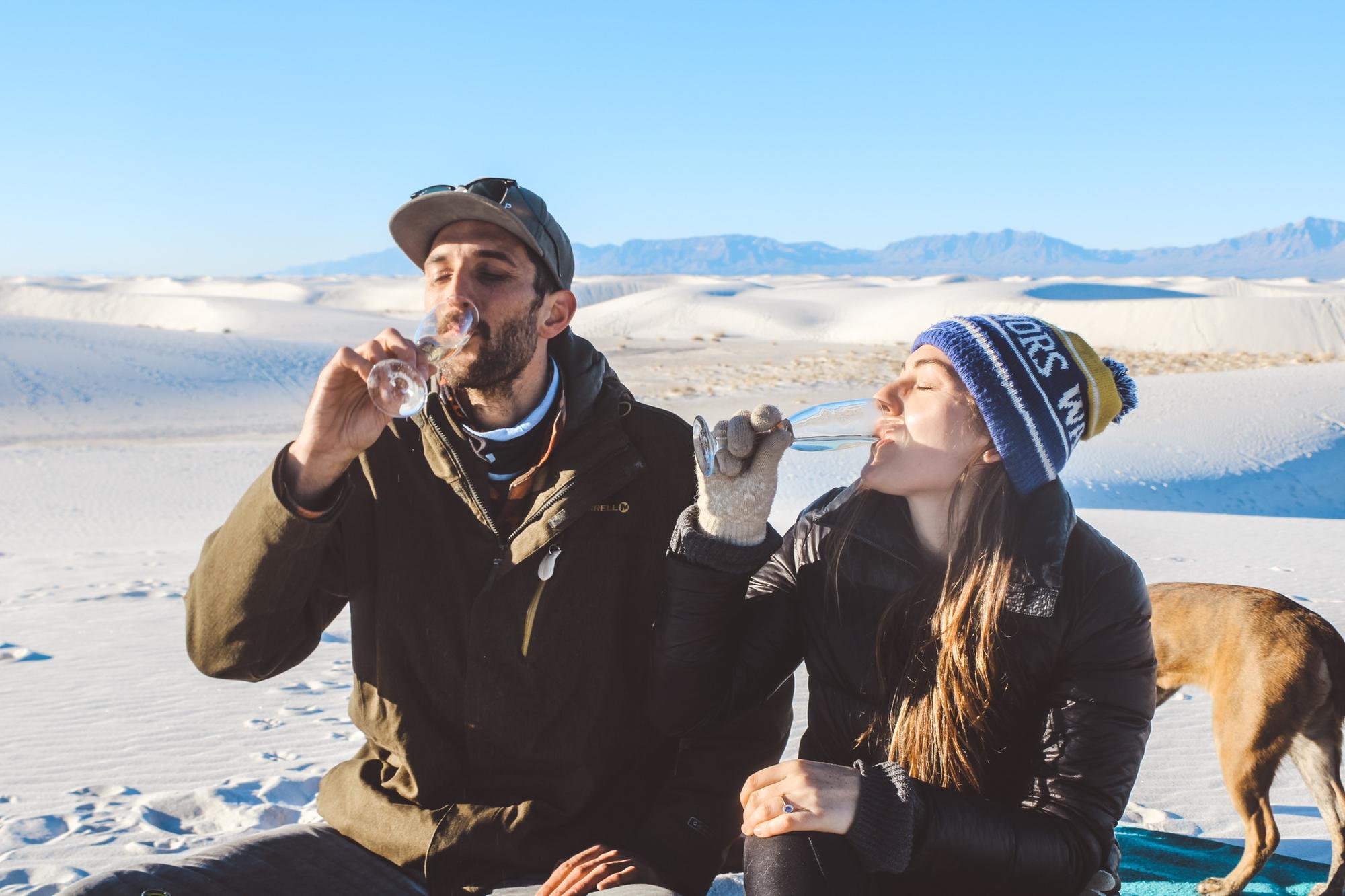 Celebrating our engagement on top of a sand dune. White Sands, NM.