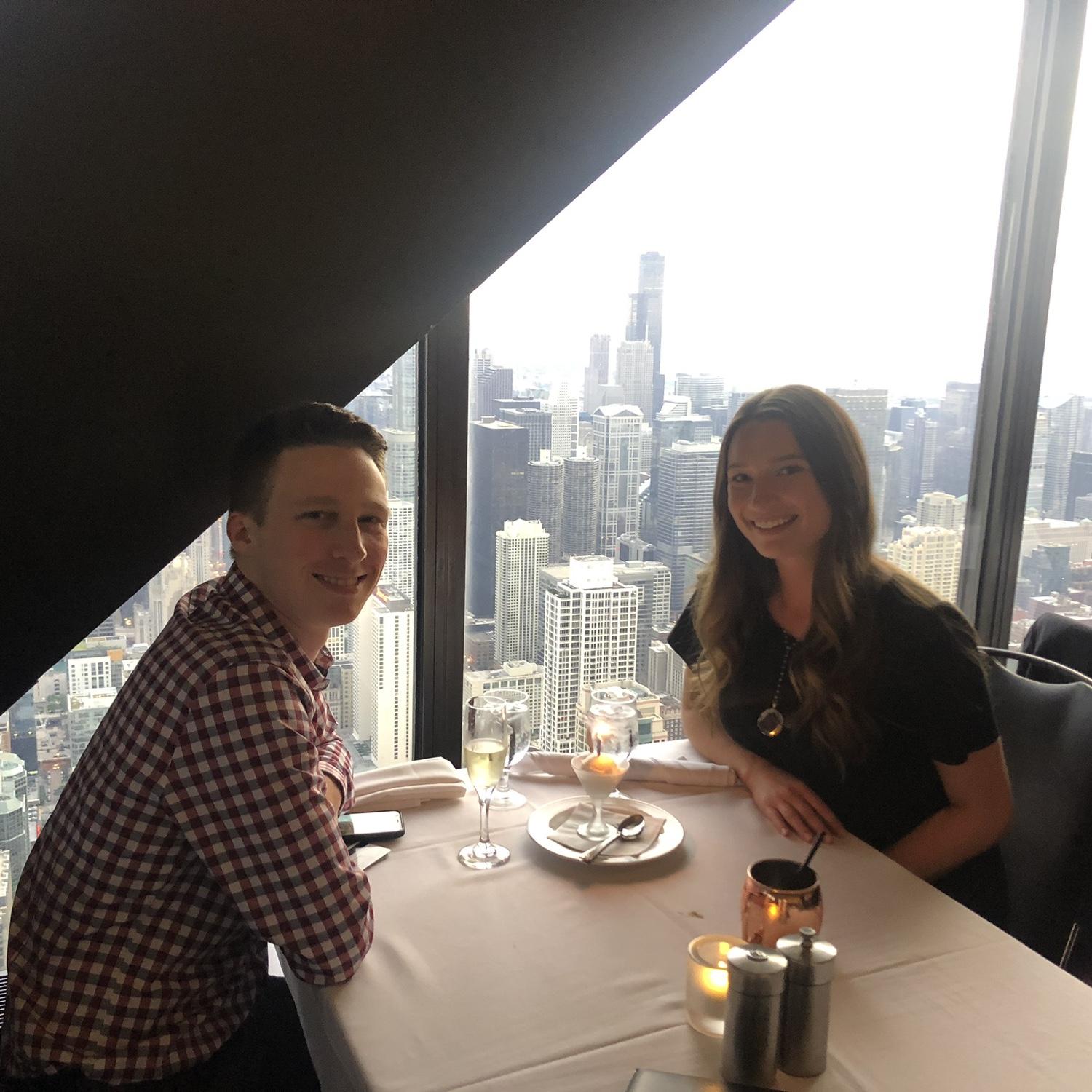 O & K treating themselves after their first post-grad pay checks at the Signature Room in the John Hancock building!
