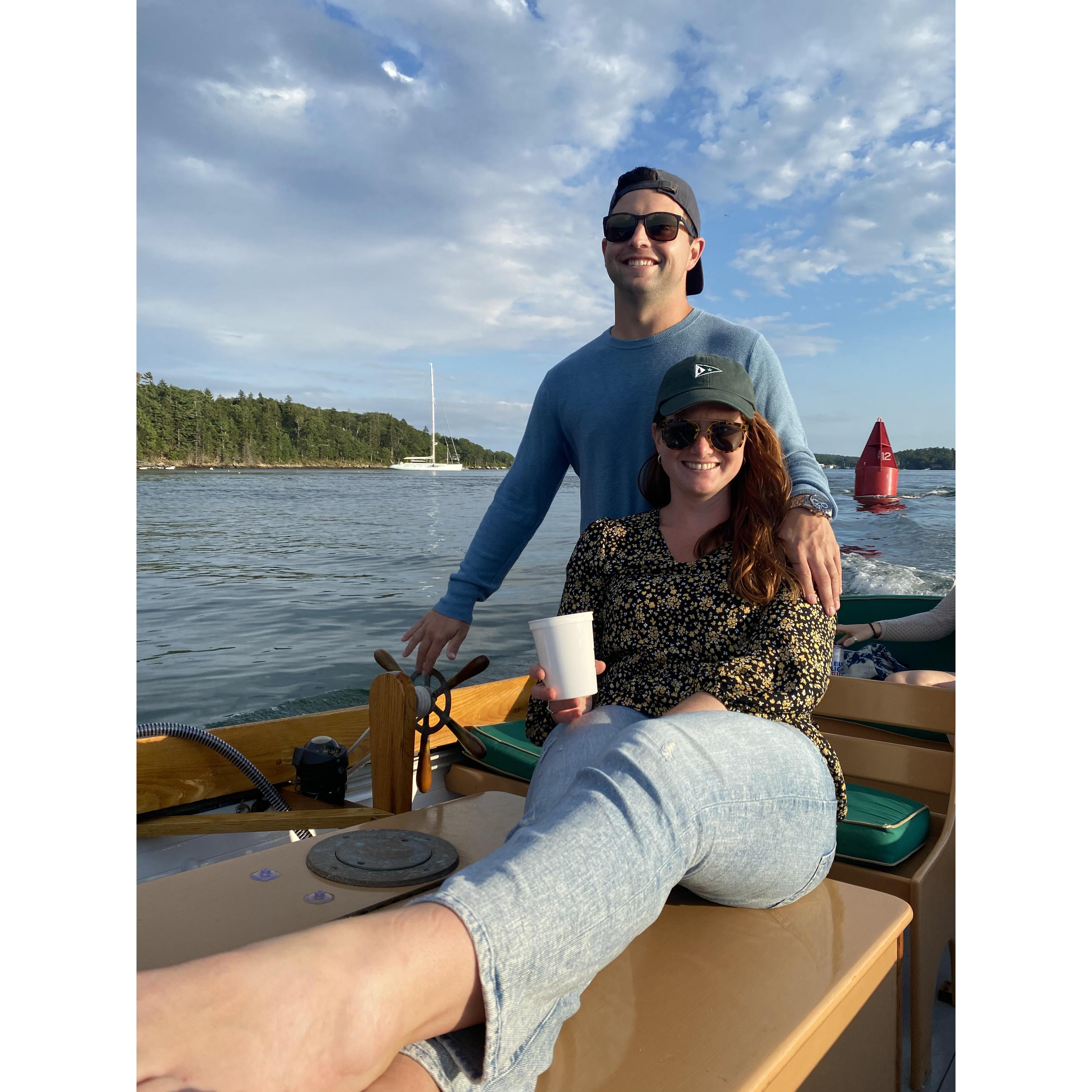 Mike loving to captain - in our happy place on a sunset boat ride!