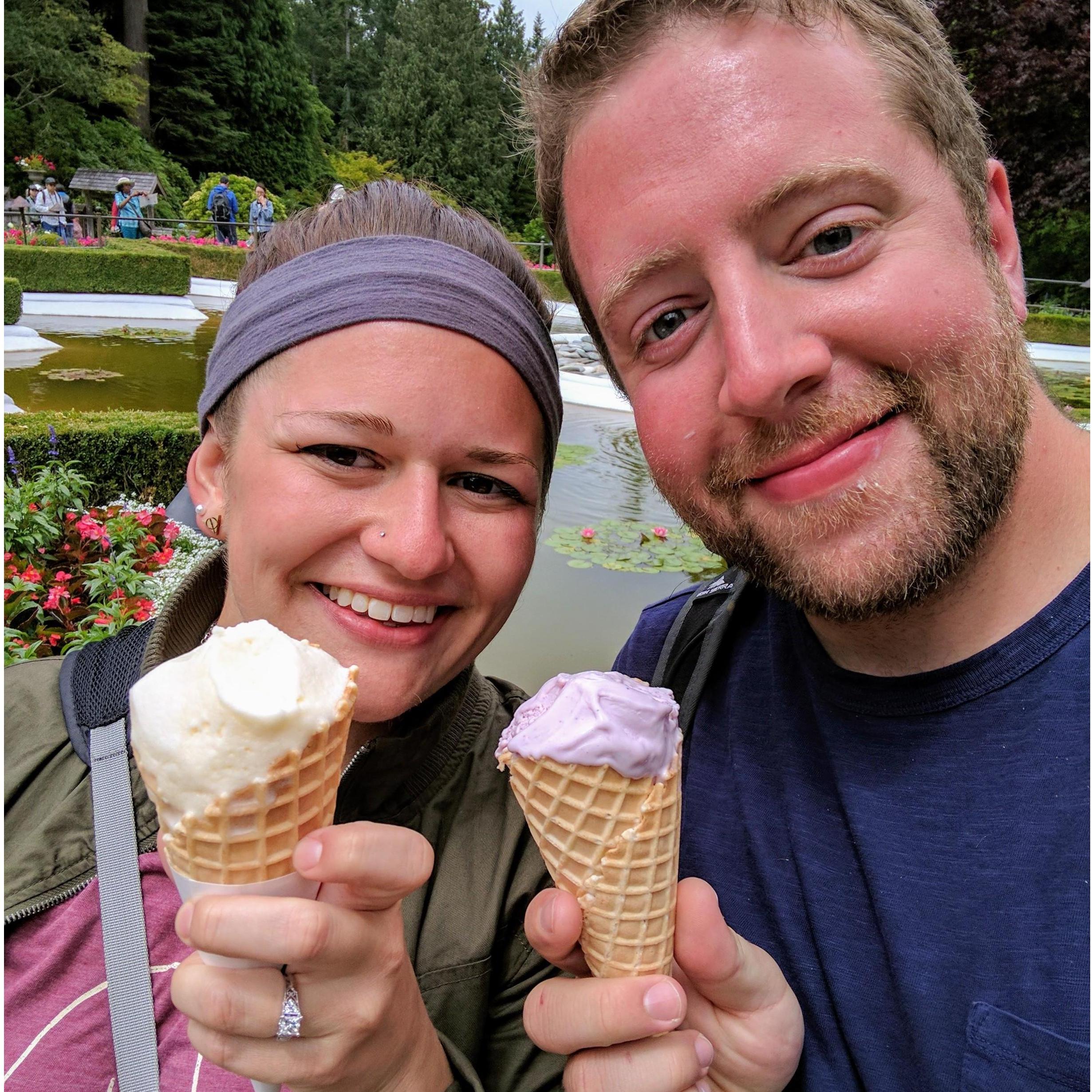 Engaged in eating ice cream.