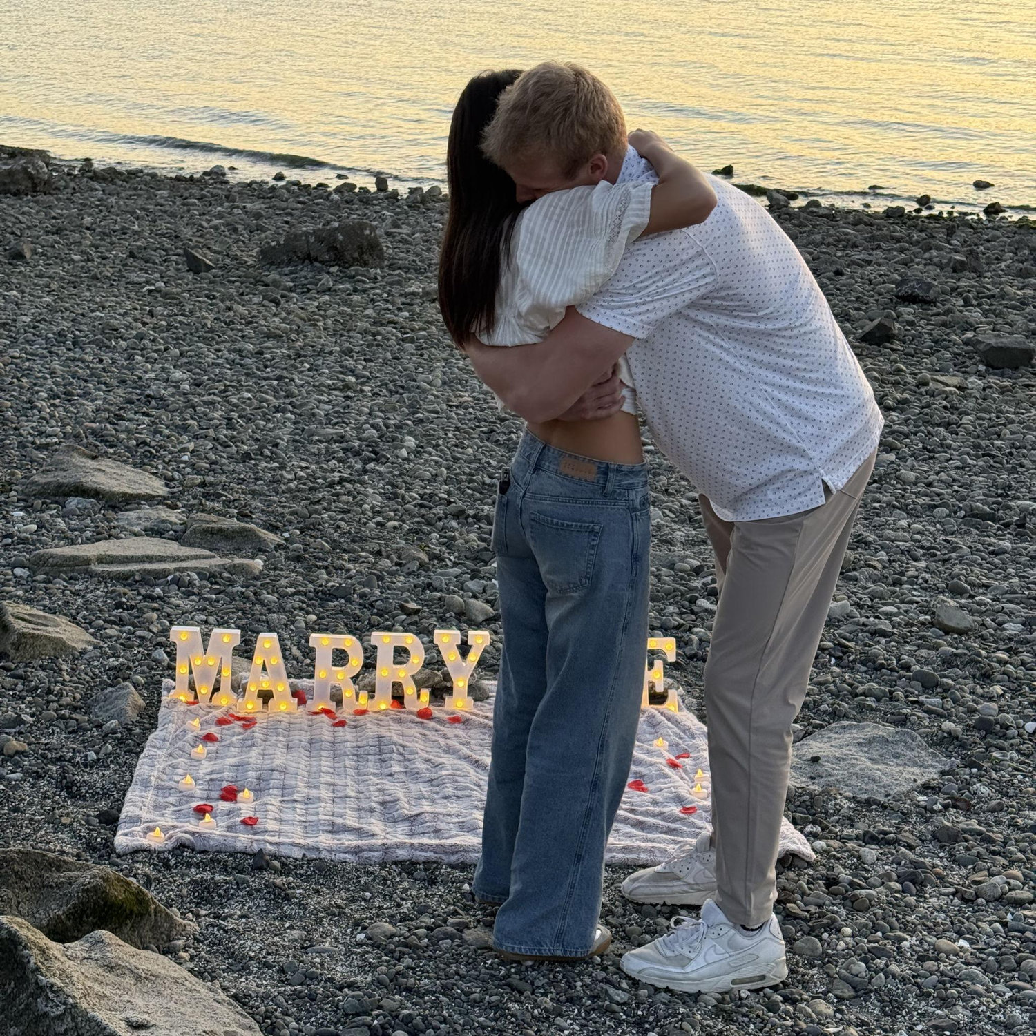 Sam proposed at sunset on a beach in Mukilteo.