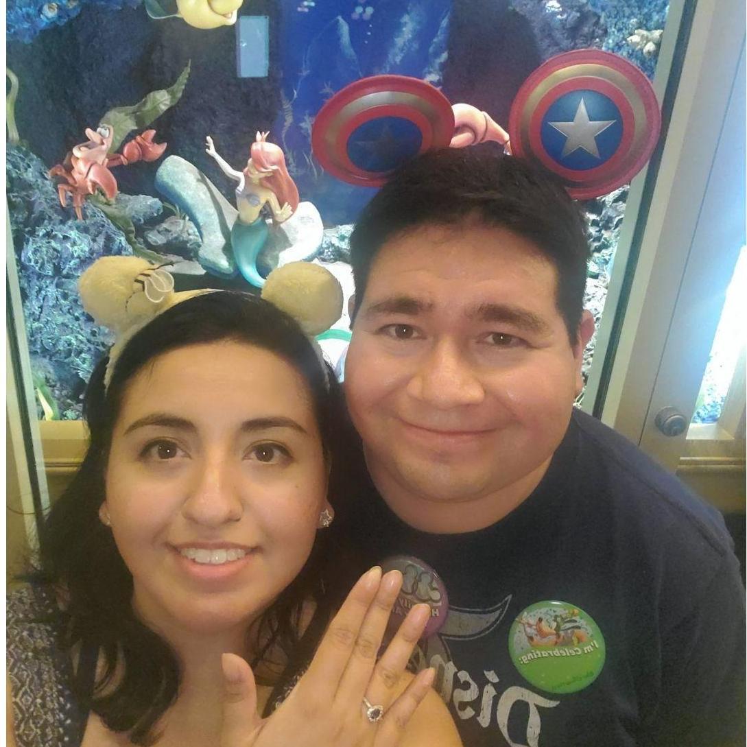 At the main castle @ Disney World, Eric went down on one knee, he popped out the most beautiful saphire and diamonds princess ring. He proposed!! With tears of excitment and love Brenda said yes!!