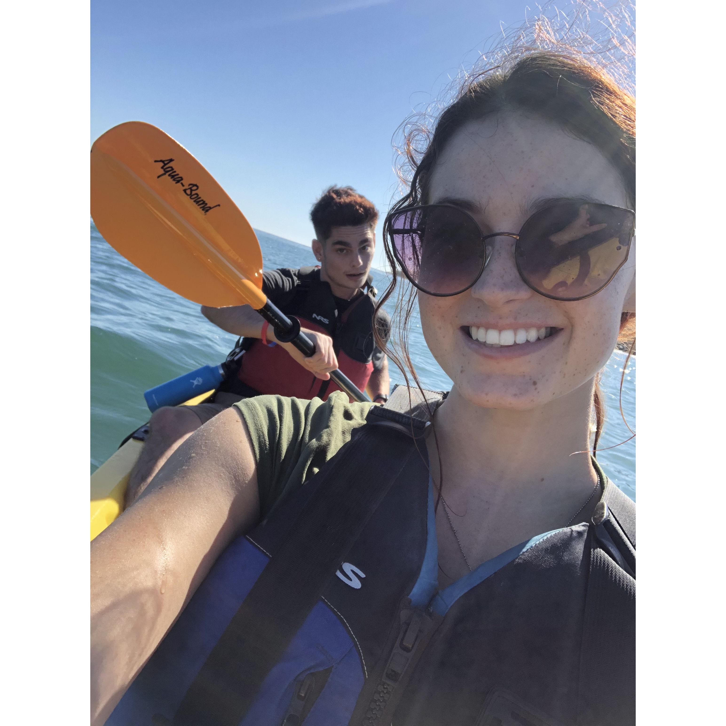 Shannon and Jason go kayaking. Jason ends up doing 90% of the work while Shannon tans.