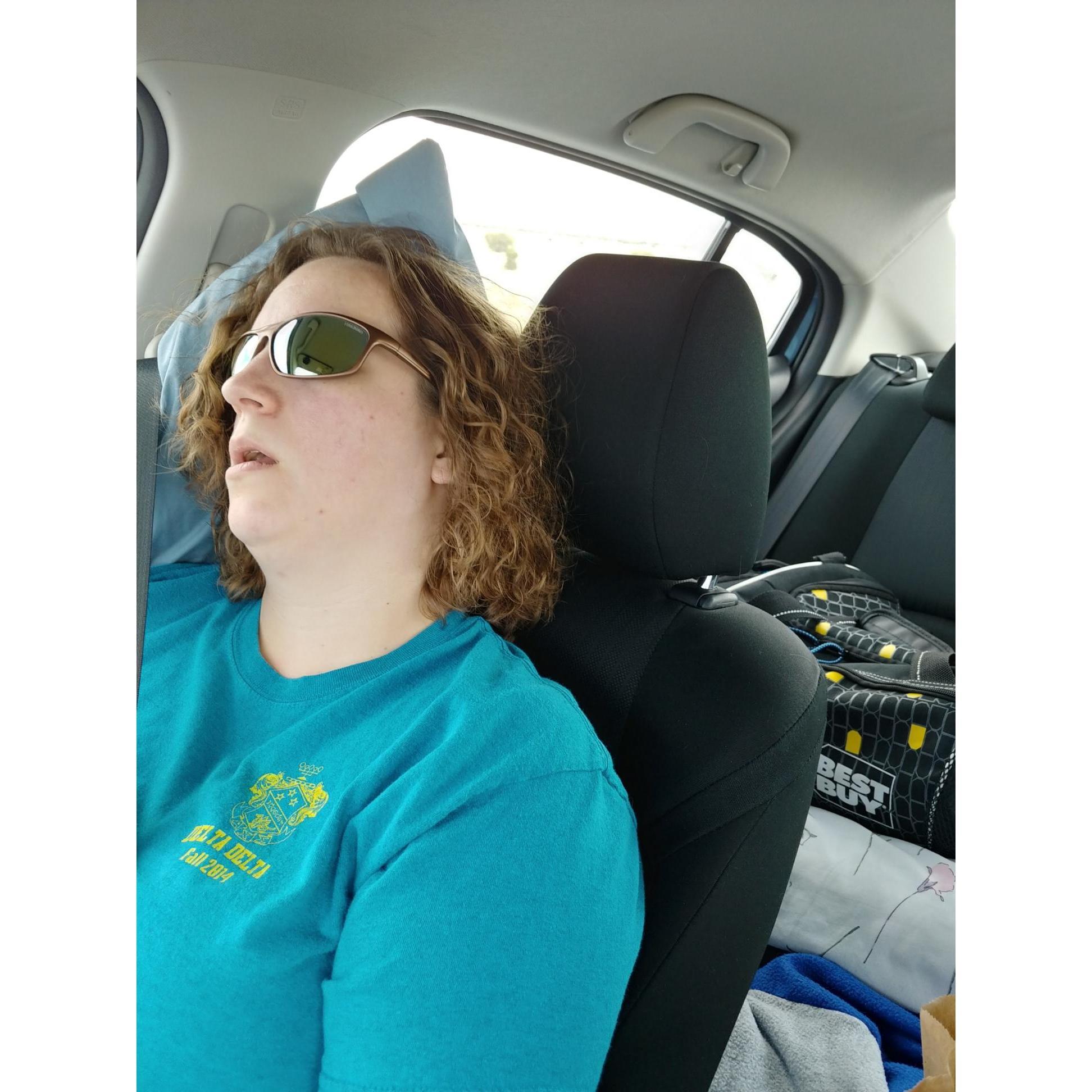 Chris takes a photo of Sariah napping on the way to CO