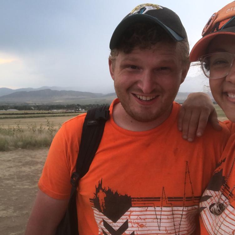 Covered in dirt from volunteering through a sandstorm, Tough Mudder Colorado, 2021