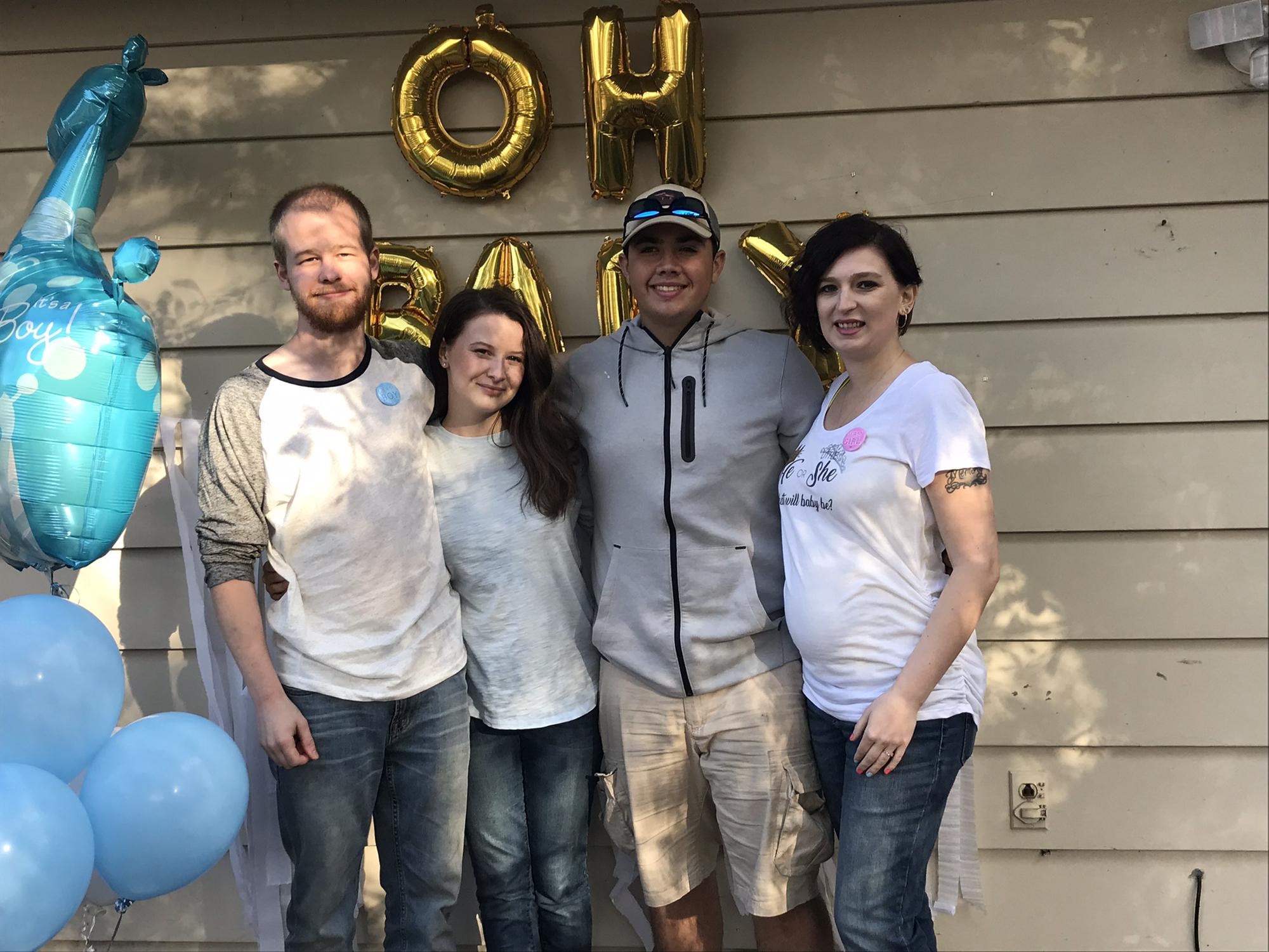 Maya and Dustin with her brother and sister-in-law after planning their gender reveal in 2018. Also their first nephew.