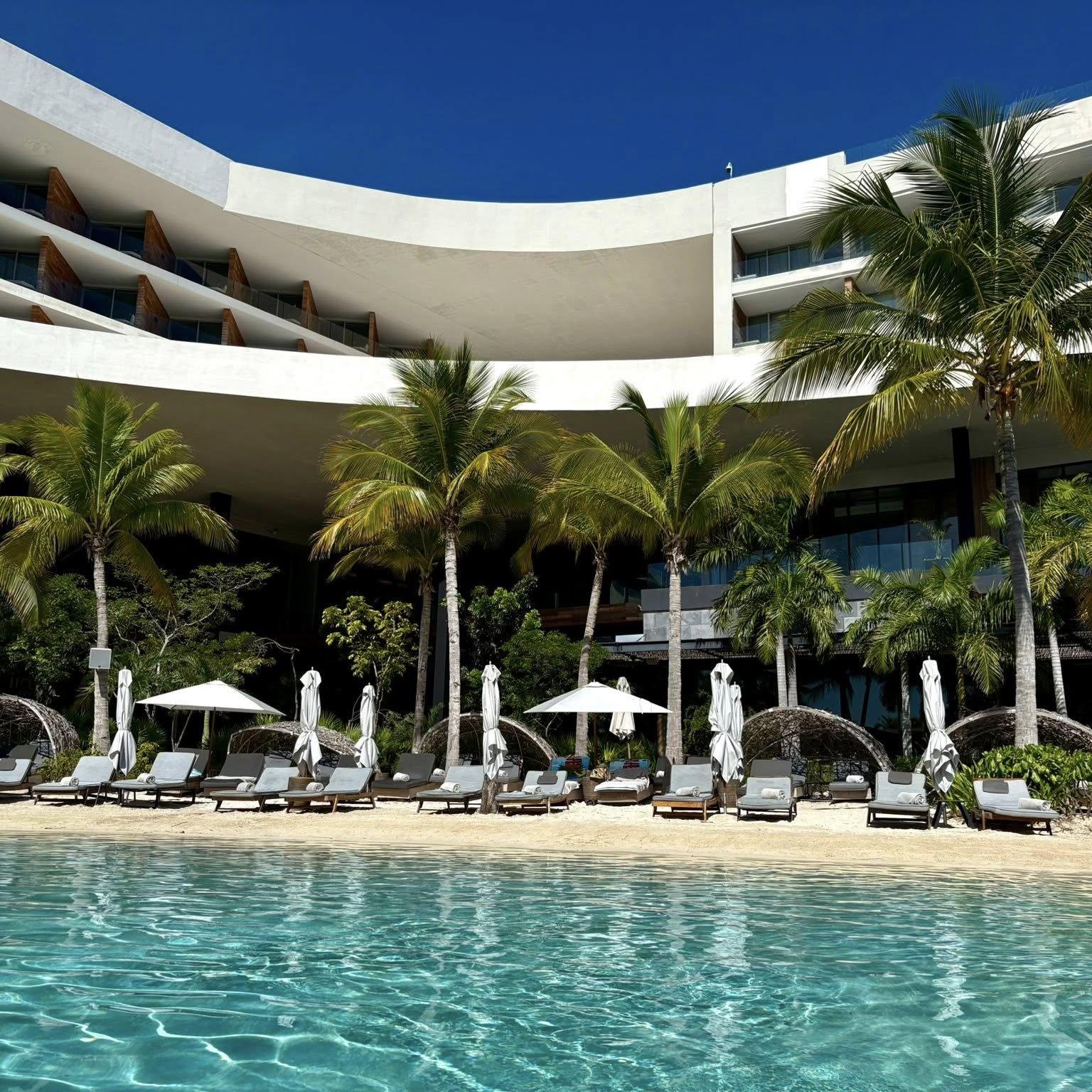 The resort has seven heated pools, including three man‑made cenotes that feel like hidden tropical hideaways.