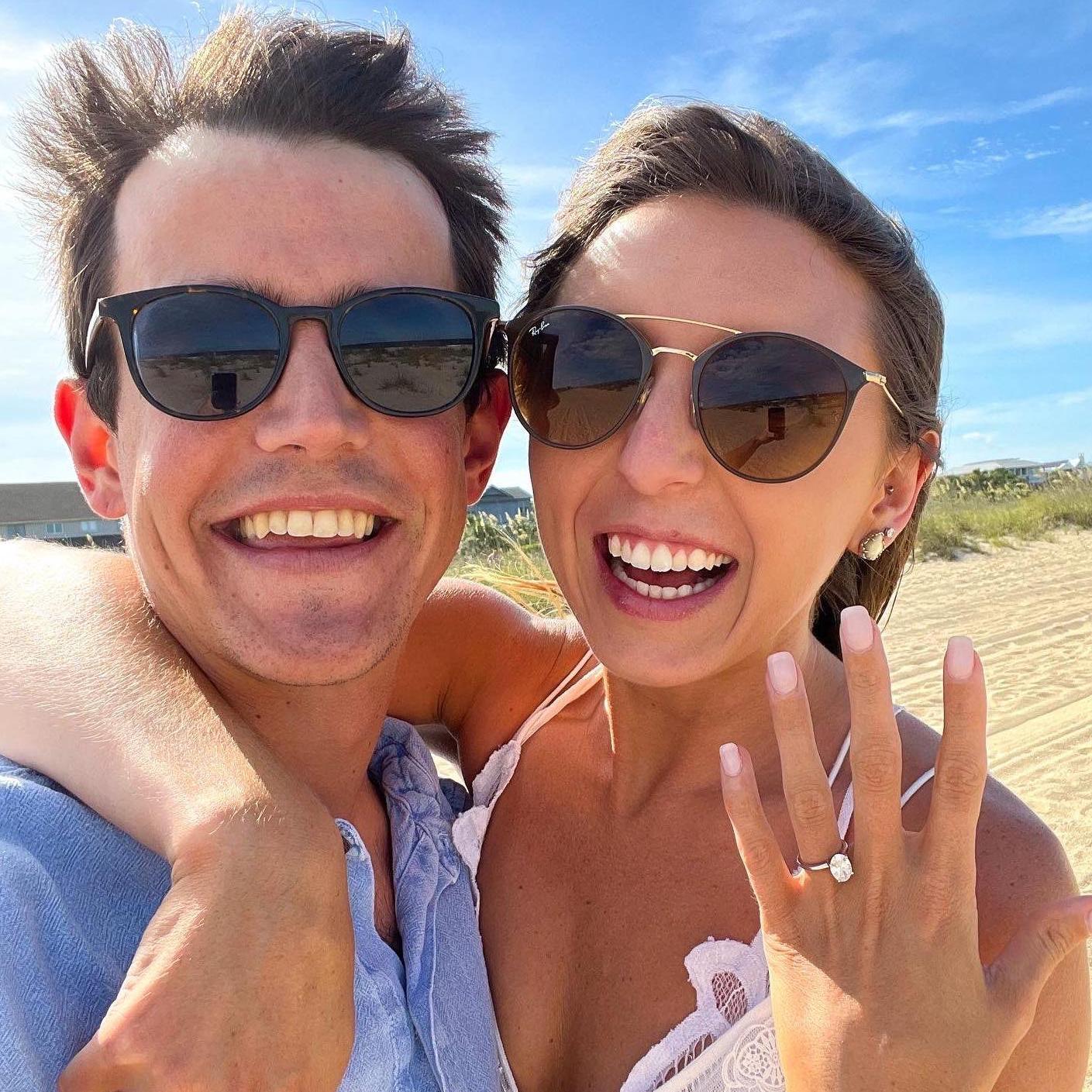 June 25, 2022 - We're engaged! On our walk on the beach Chad popped the question and neither of us could stop smiling (hence the huge smiles in the pic!)