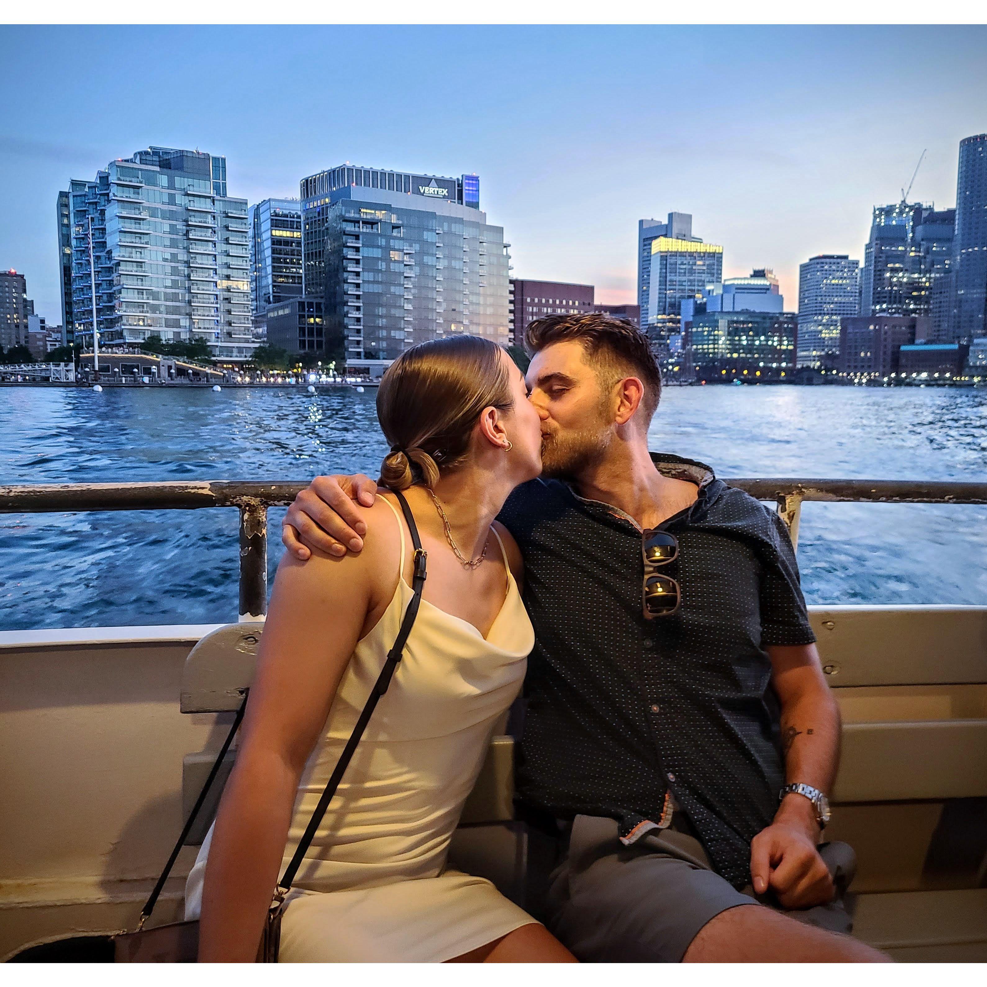 Sharing a kiss on a Boston Harbor boat cruise we took with our bridal parties back in July 2022