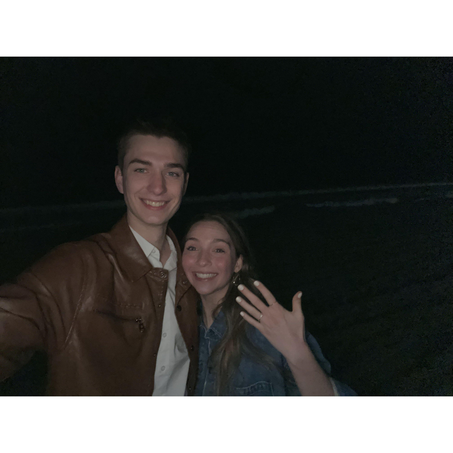 This moment was captured right after Dave proposed on the beach in San Diego!