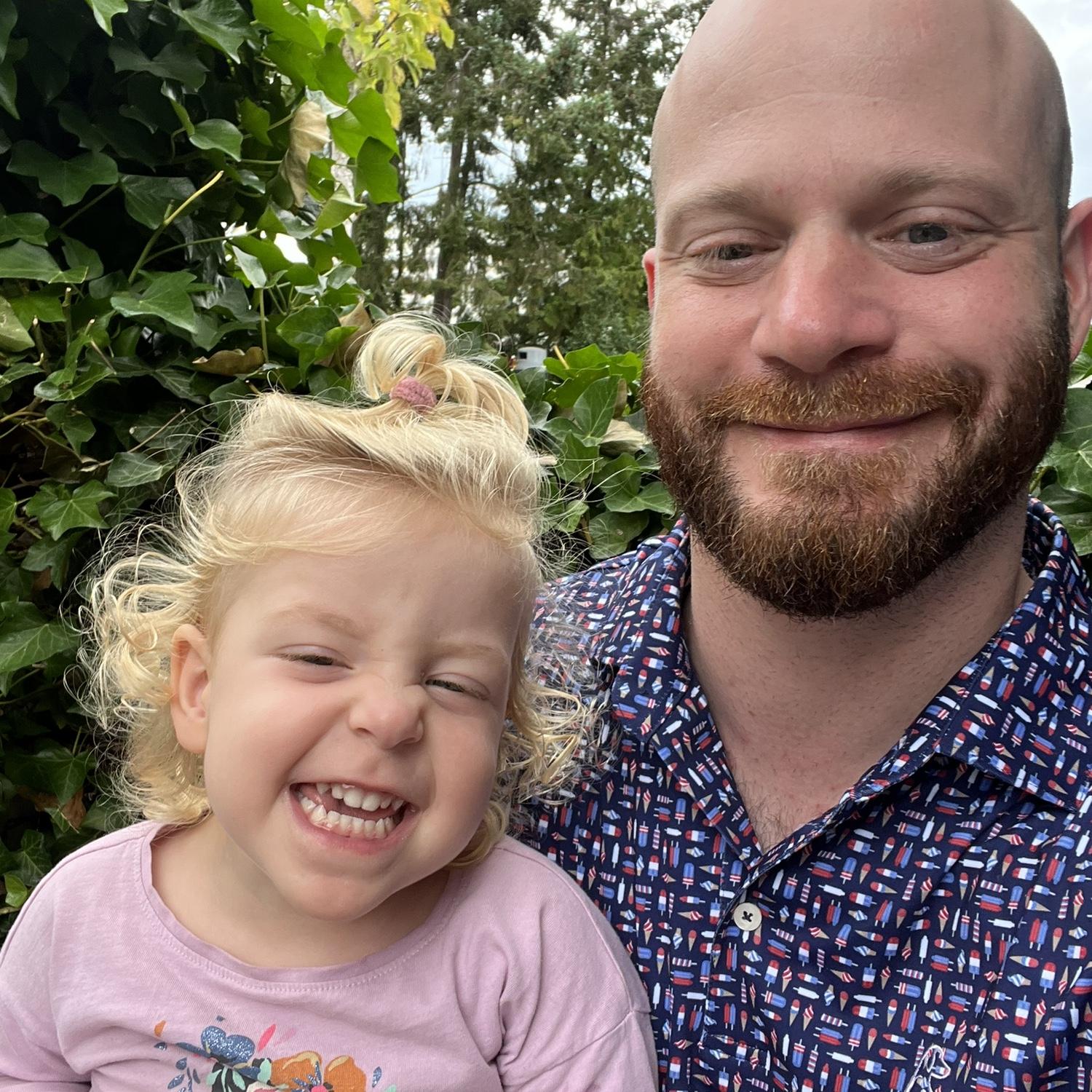 Charlotte showing Brycen how to smile correctly