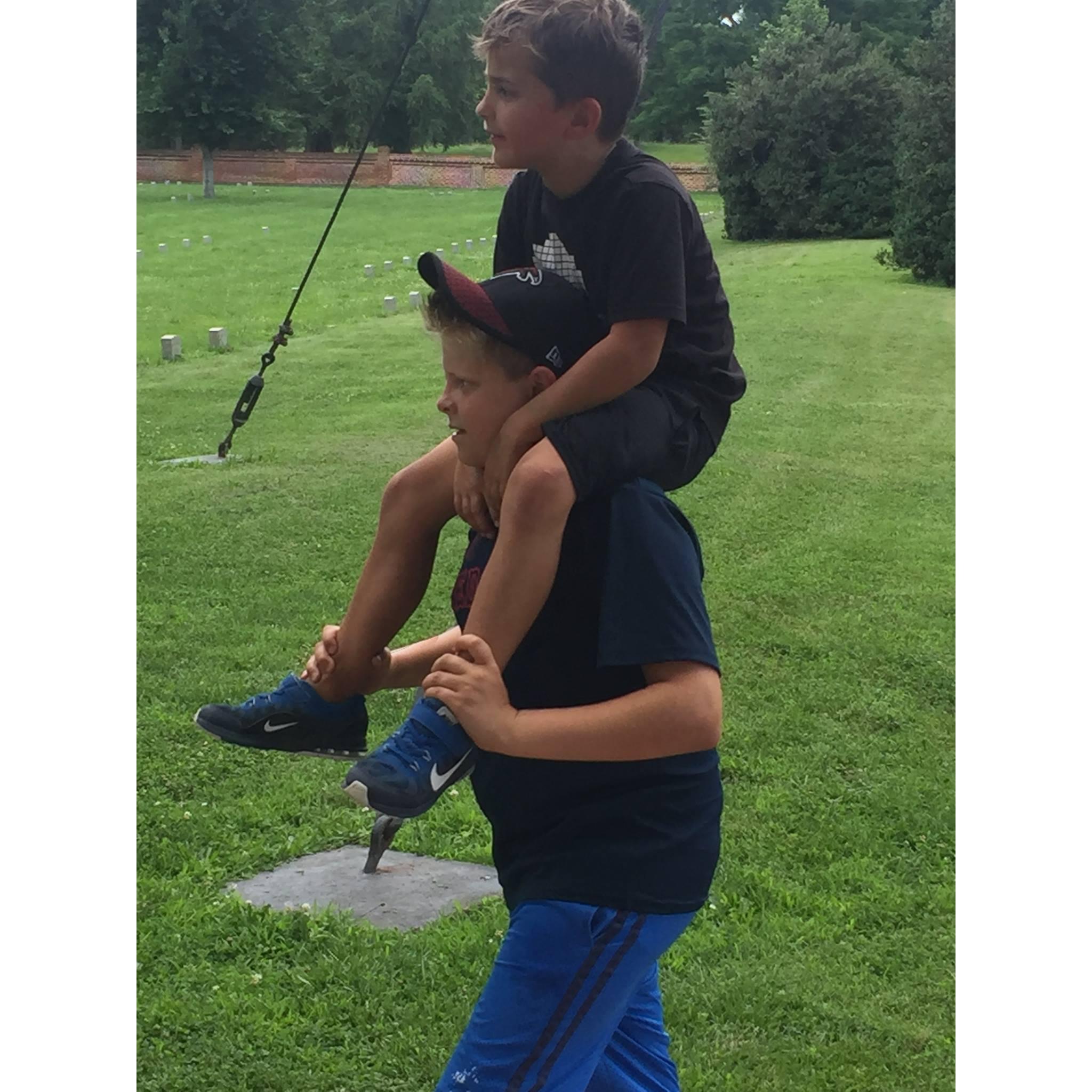 Keenan on Camden's shoulders while we toured Arlington National Cemetery