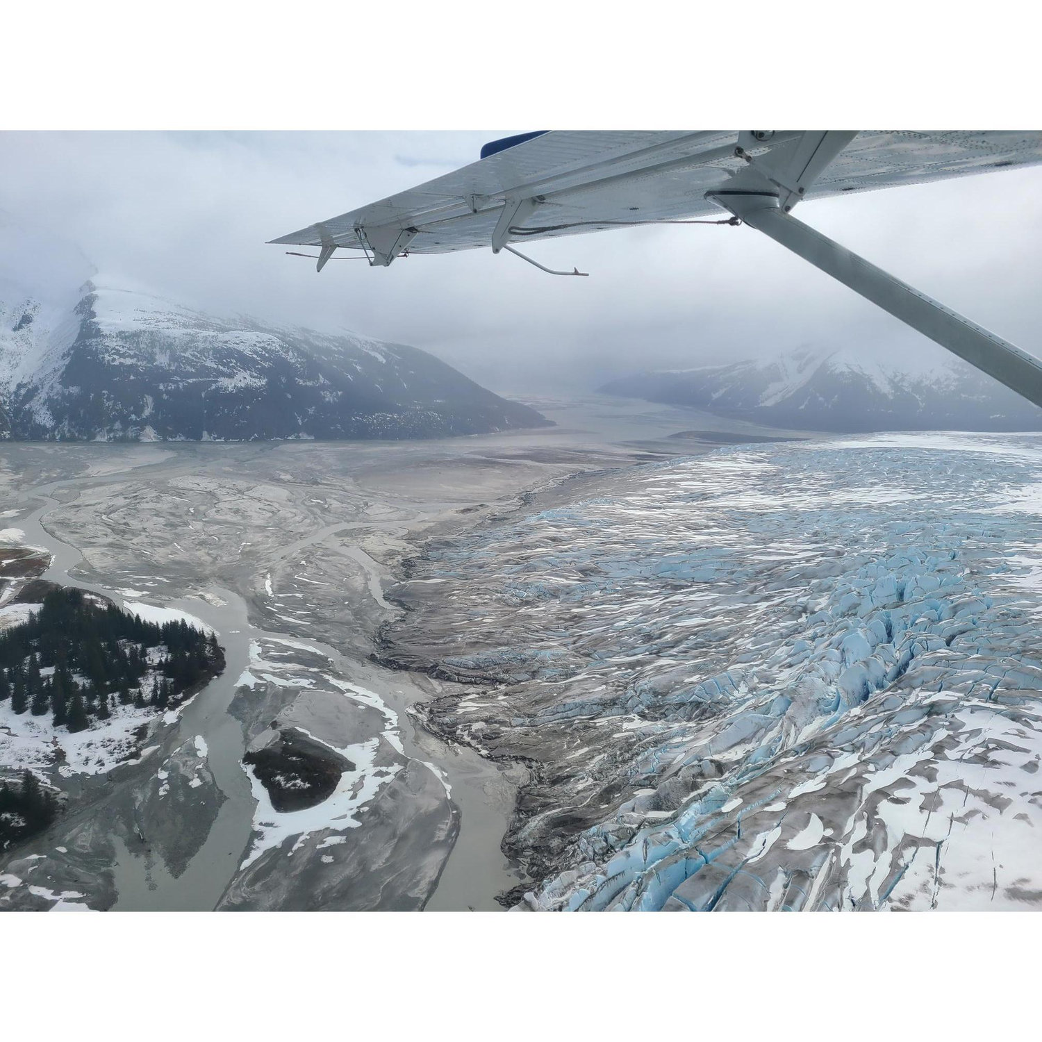 flying over glaciers on the way to Taku Glacier Lodge
