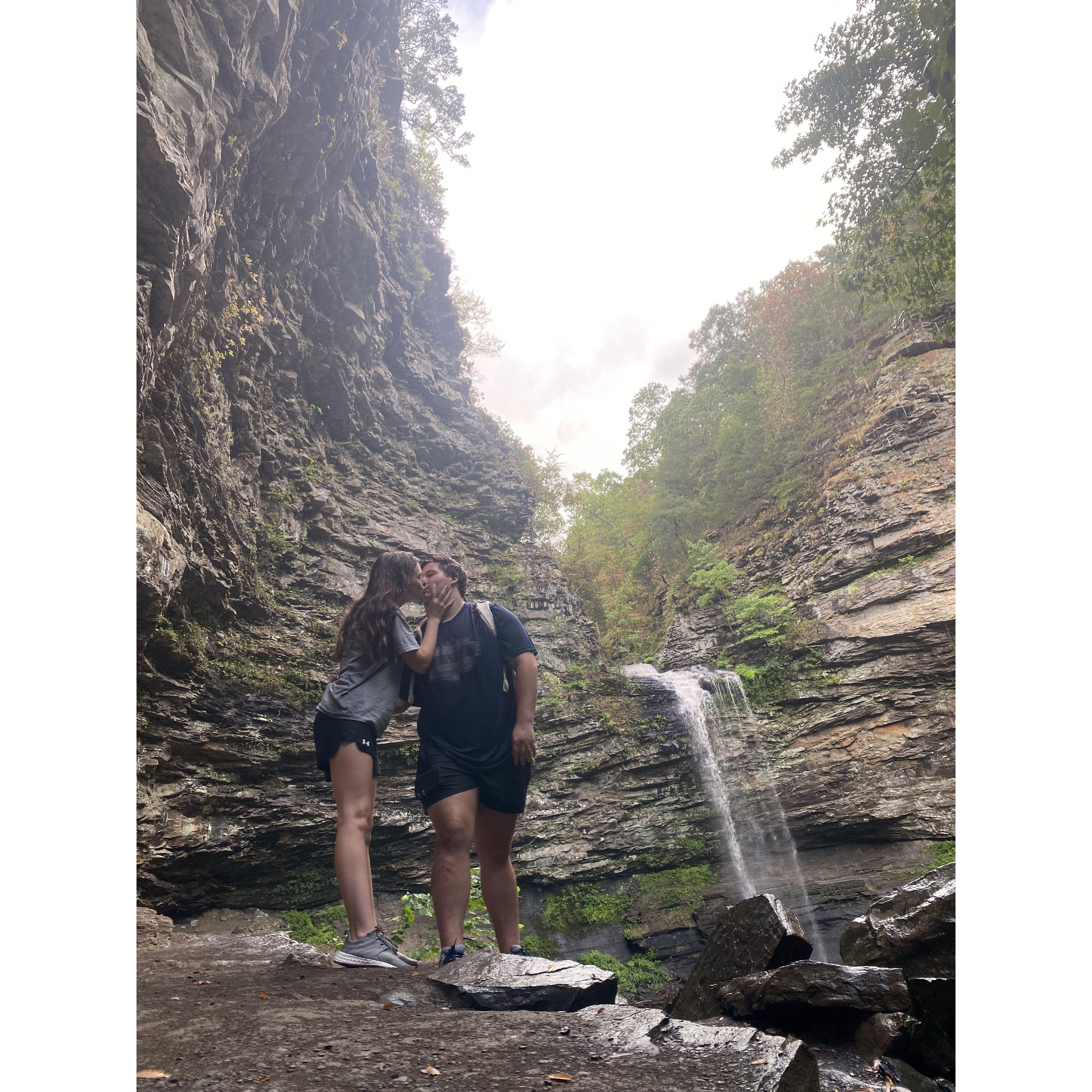 Sam's fav memory. We went and hiked Mt. Petit Jean. On the way down it was easy, but on the say back up it was so exhausting Haley cried. It was raining so hard the waterfall became huge! August 2021