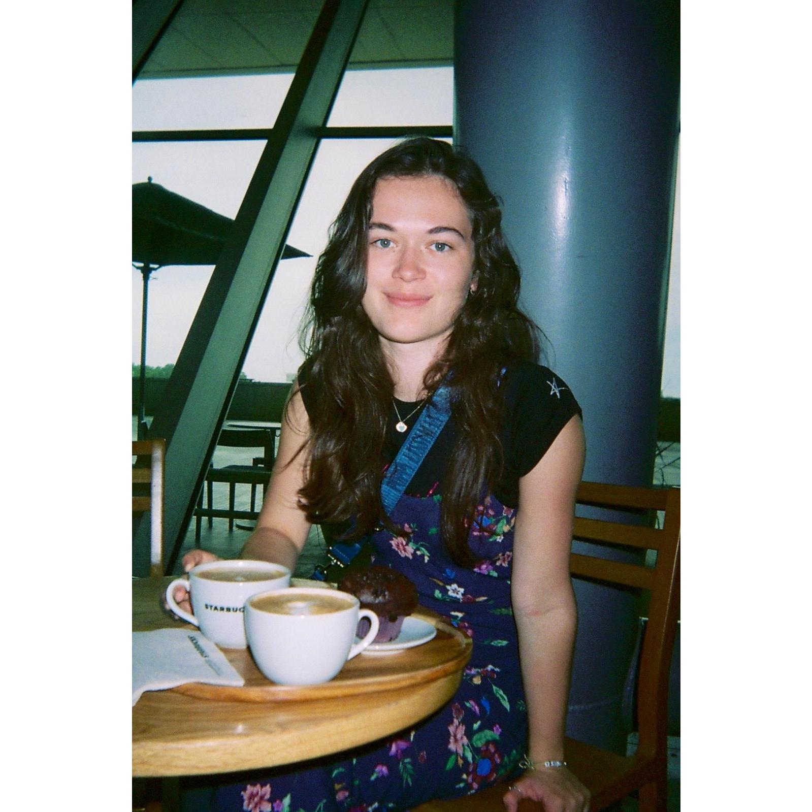 Our farewell tradition: sharing flat whites and a chocolate muffin at the airport