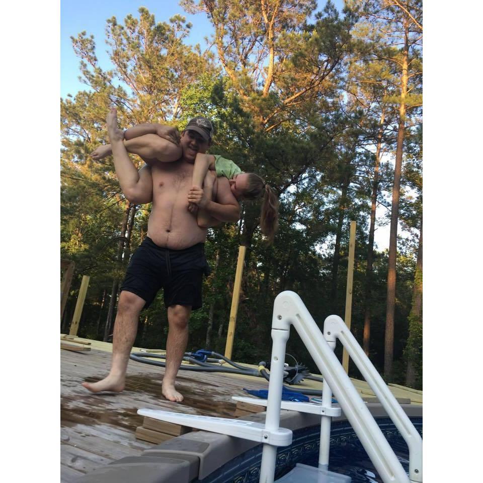 I splashed Justin which resulted in me being thrown into the pool.