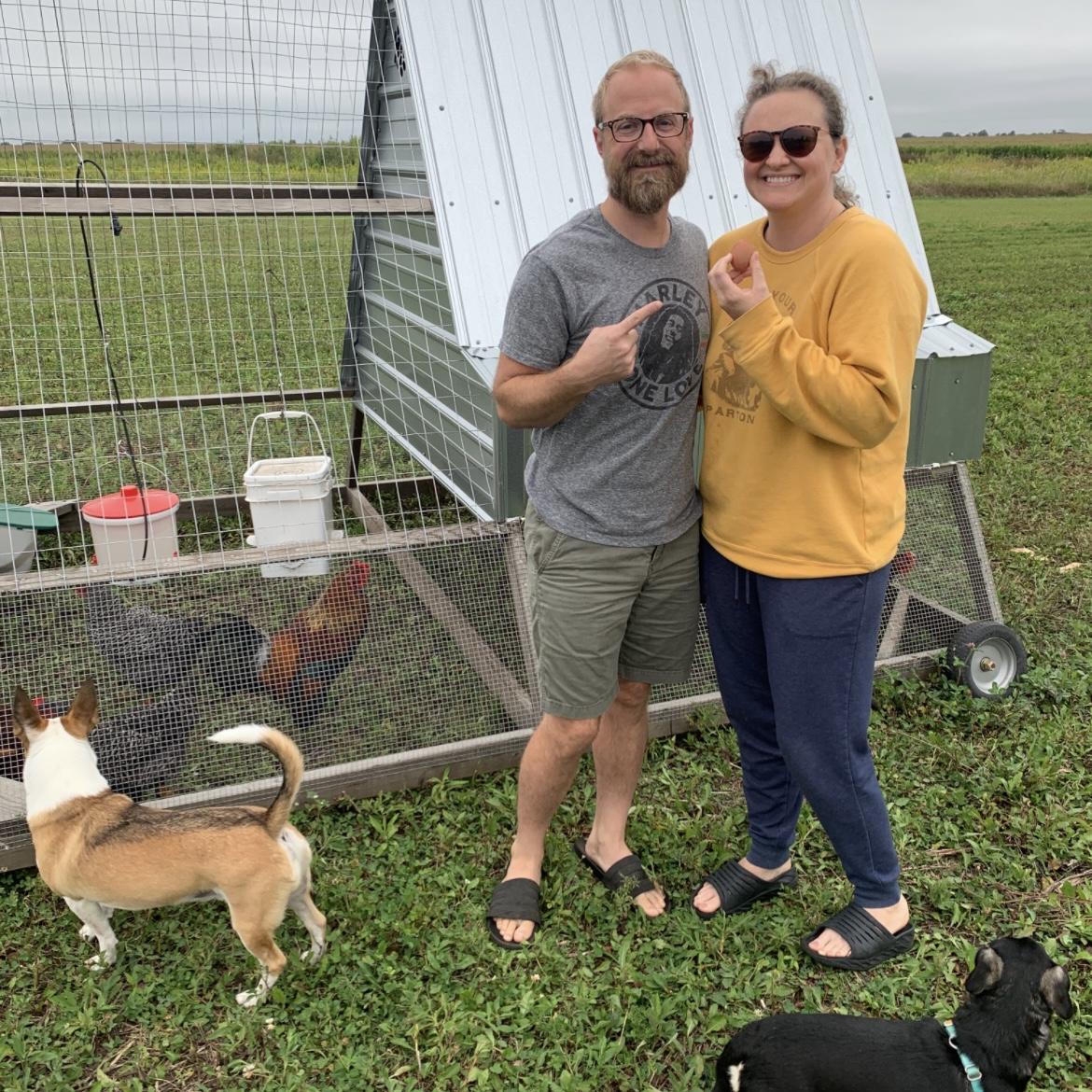 Our first ever egg produced by our chickens. Thanks to Eric, Dave and Nigel for just happening to be there to take our photo! Perfect timing.