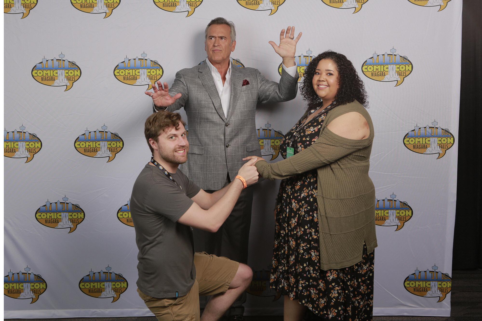 We actually got engaged the night before this picture was taken. We told Bruce that we needed his help announcing our engagement & this was the result!