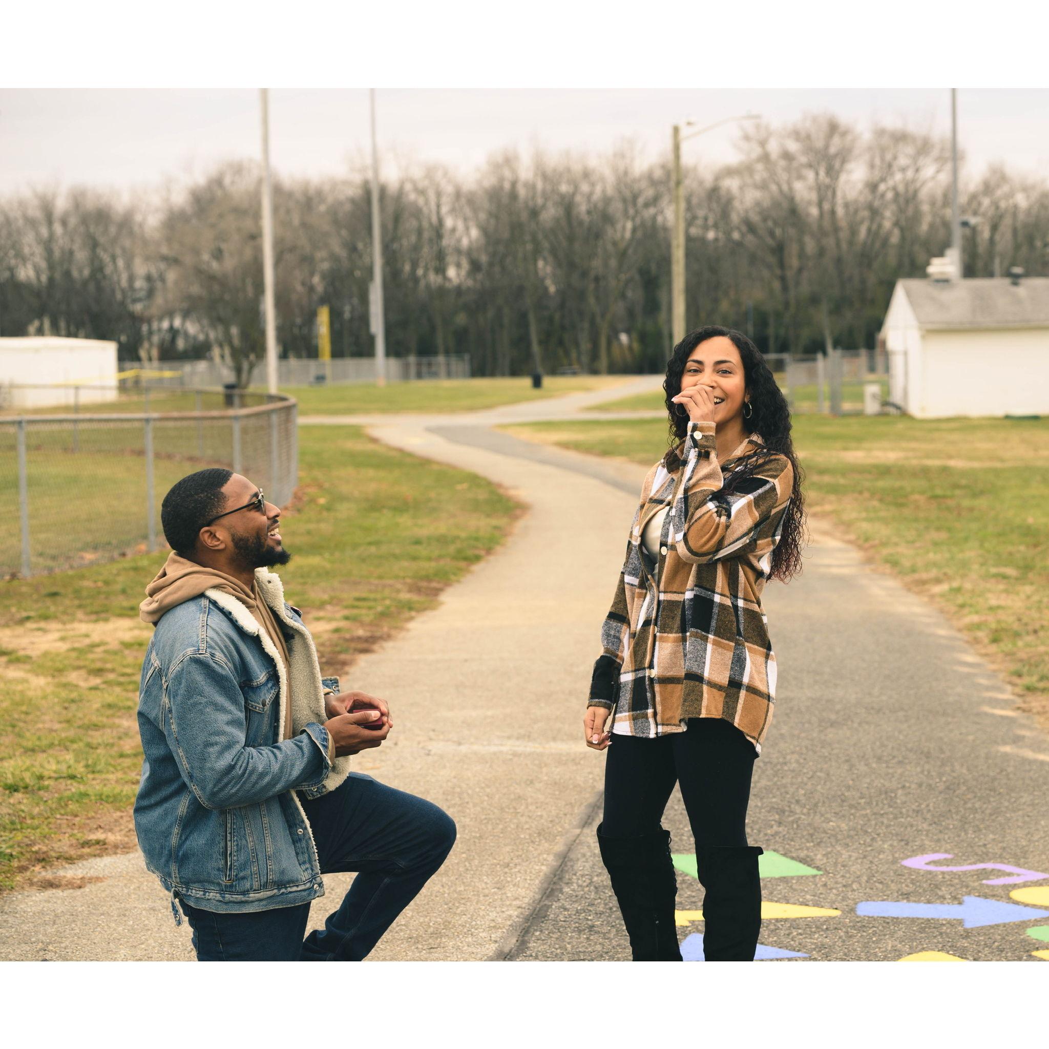 This was the moment Ariana saw her friends and family standing there, holding a sign saying MARRY ME, as Darryl got on one knee! Realizing he had planned this photo shoot proposal!