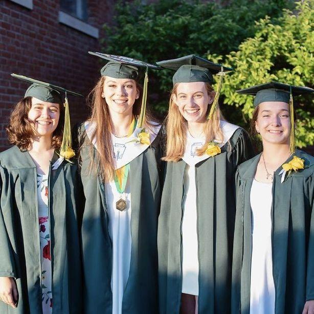 Serenity, Olivia, Megan, and Alsacia at Peoples Academy graduation, 2021