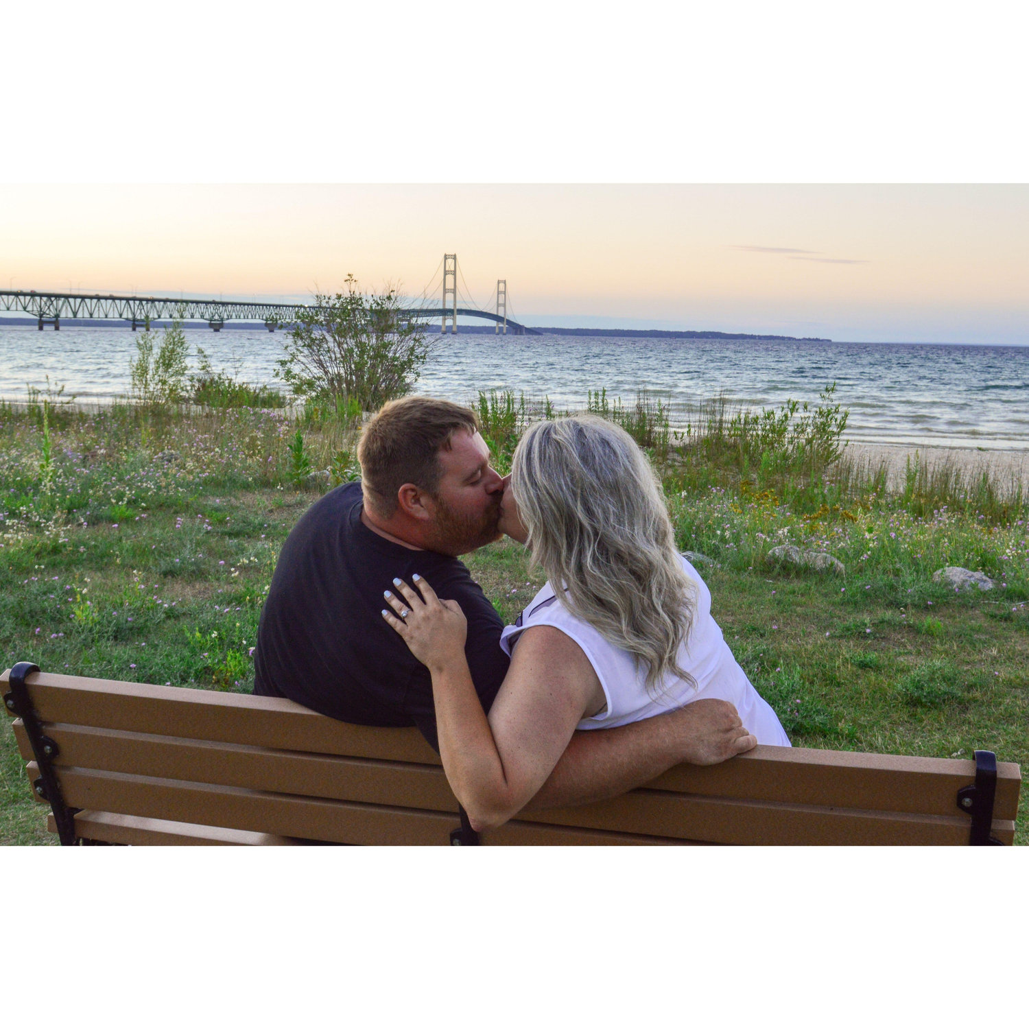 Us kissing by the Mackinaw Bridge.