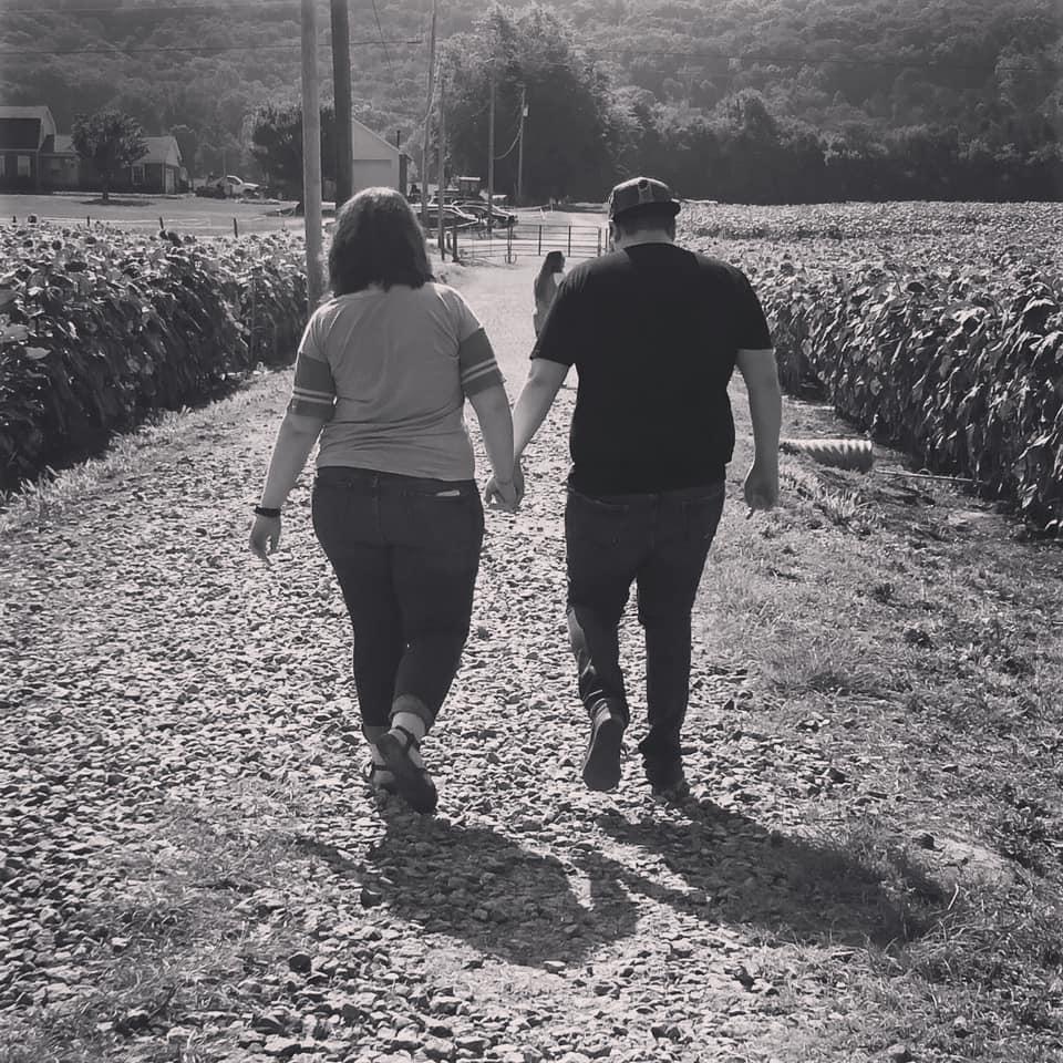 He took me to the sunflower field, finally. His mom snapped this picture of us.