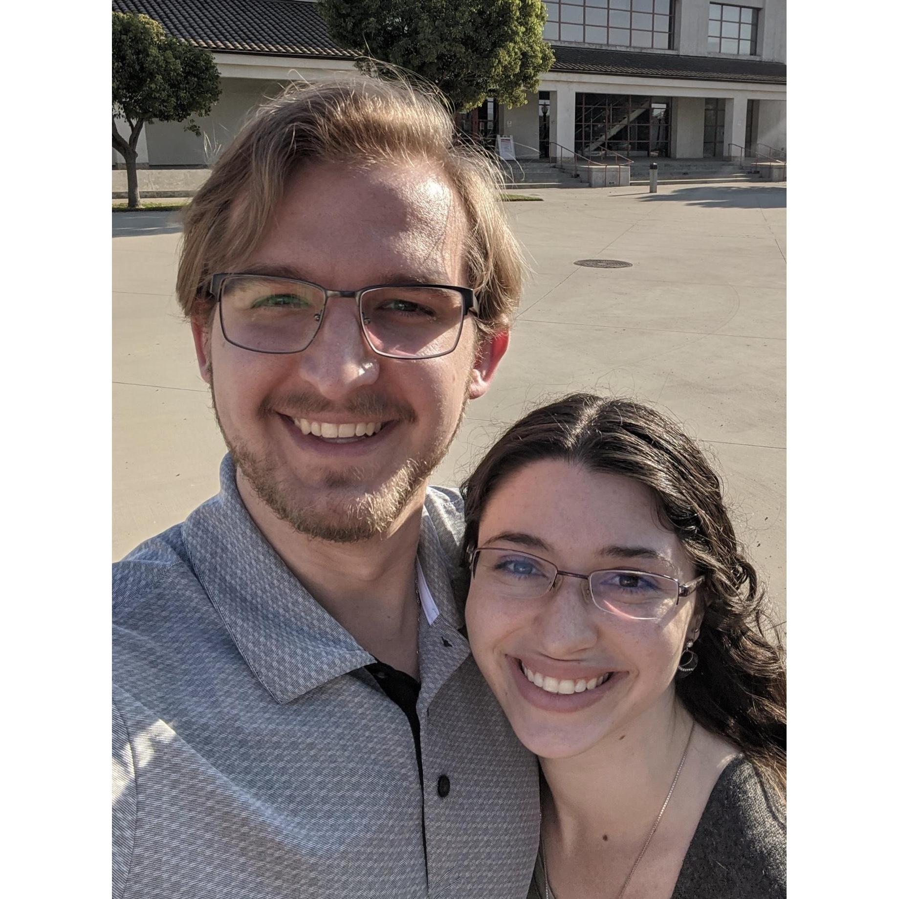 Us in front of the building where we met on the CI campus on our 5th Anniversary where we re-enacted our first date.