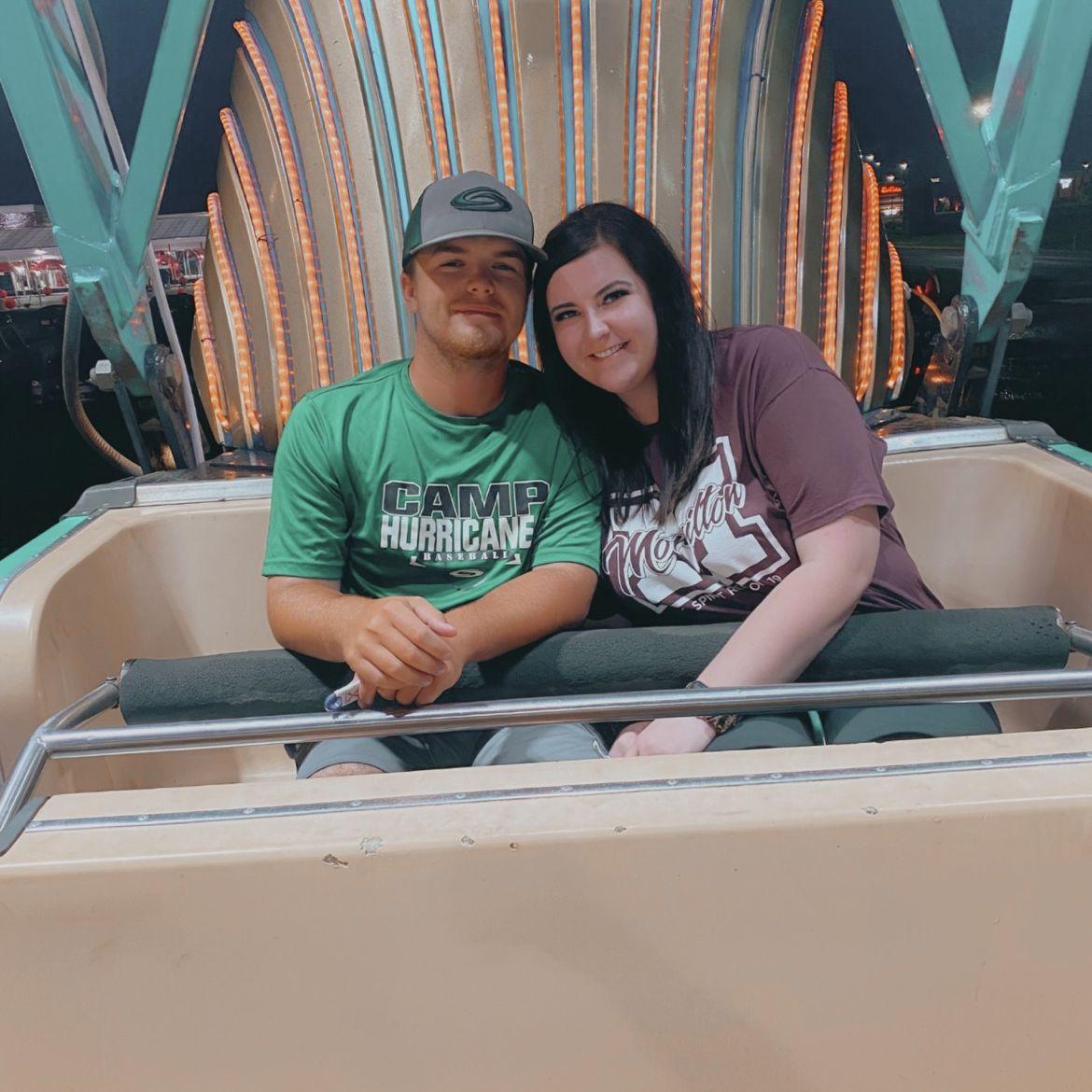 Our first picture together right before we started dating. We still love going to the fair together - now it's our coaches night out!