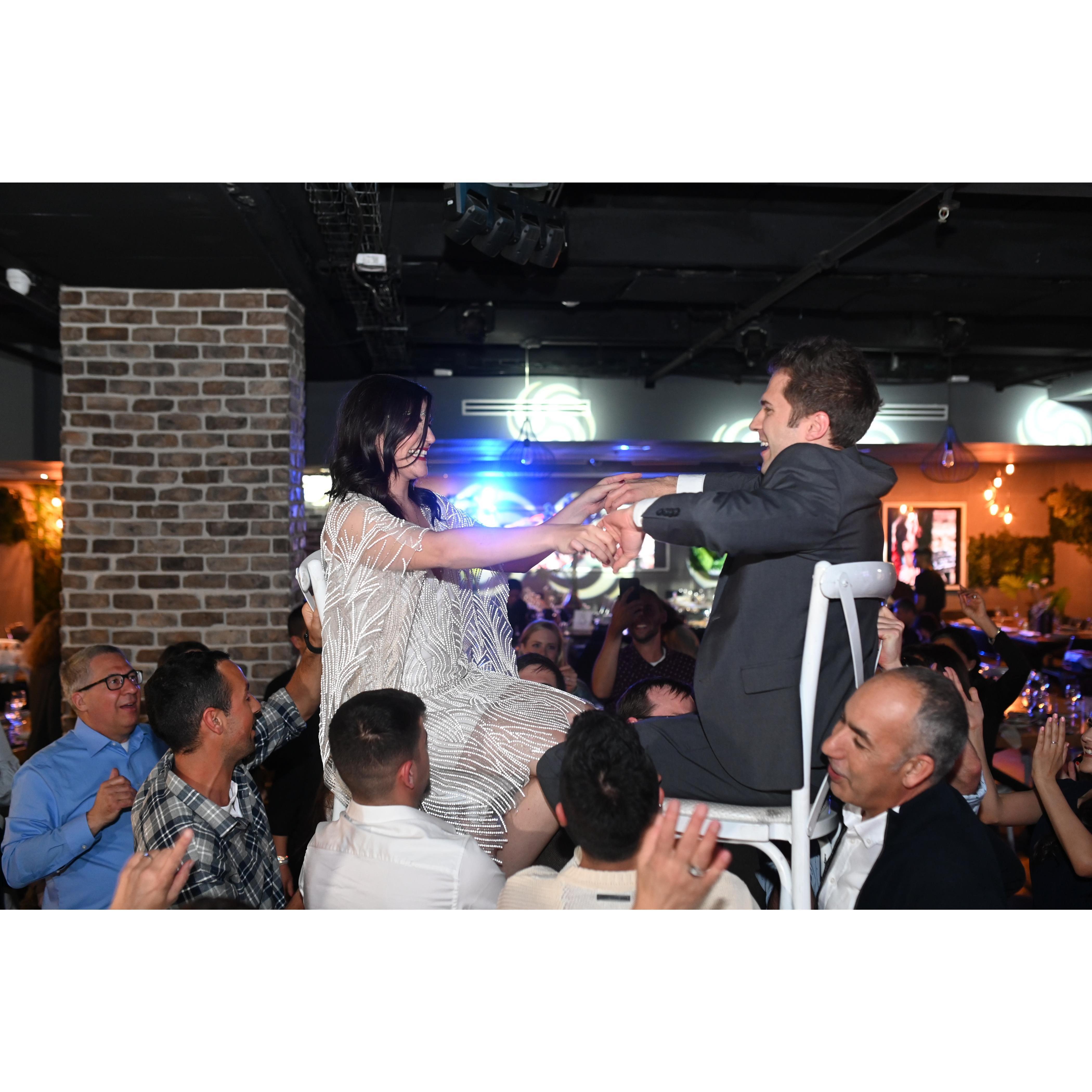 Andrew felt very honored to be raised up on a chair at Jewish celebration. We think the family has approved!