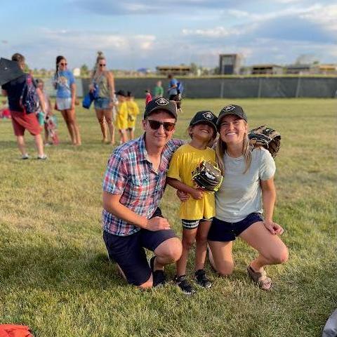 Auntie Avery and Uncle J.D. cheering on niece Eleanor's t-ball game