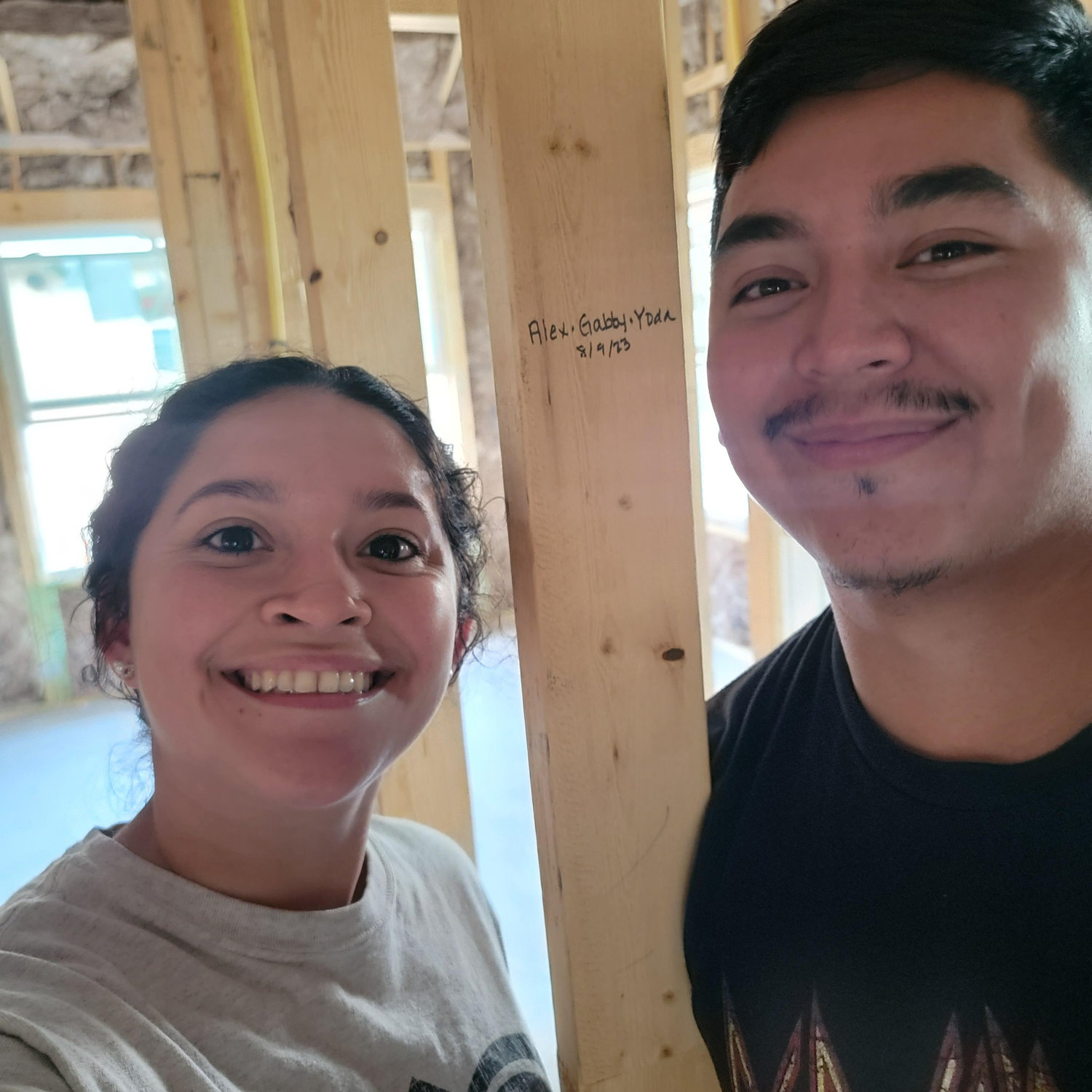Signing the frame inside our home