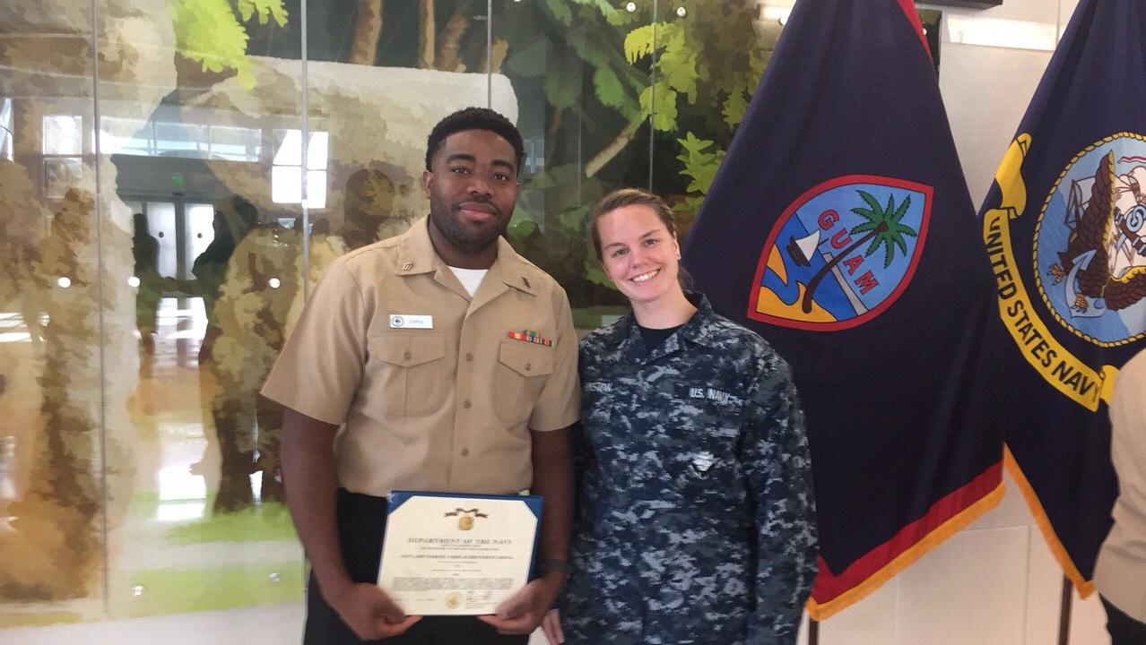 Shea receiving his end of tour award in Guam.