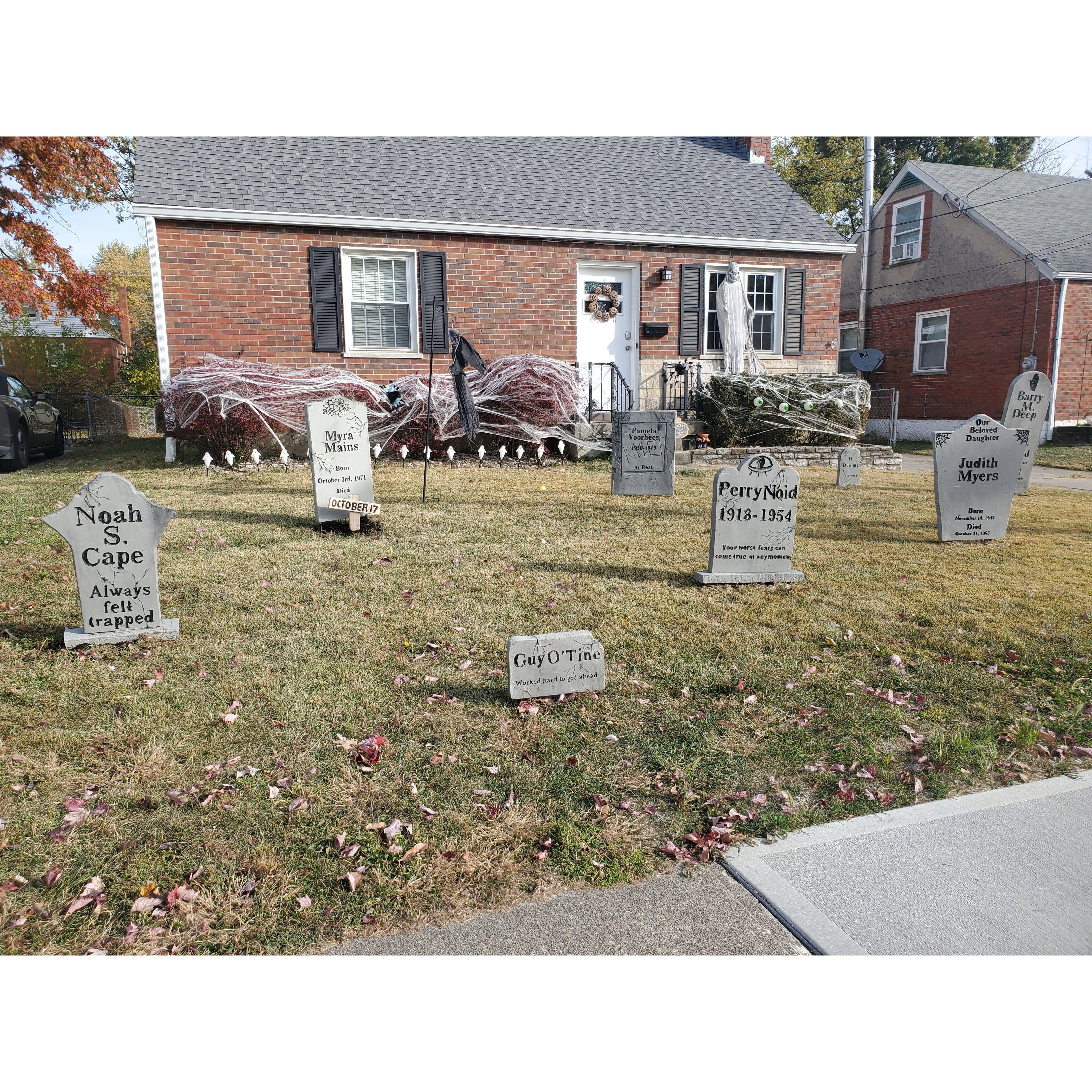 Our house for Halloween 2022, after we hand building each and every one of those gravestones together.