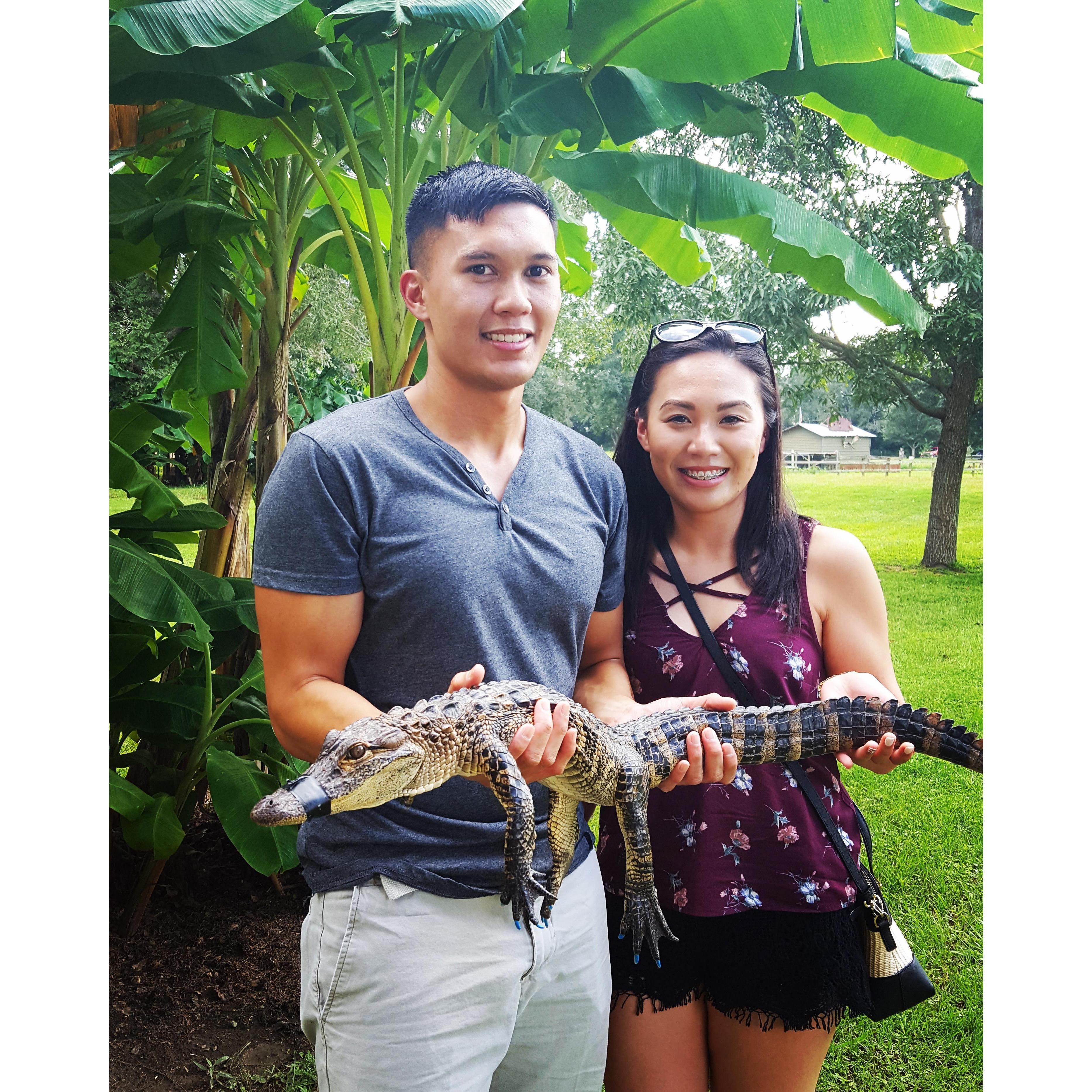 Casually holding a baby alligator somewhere in Alabama.