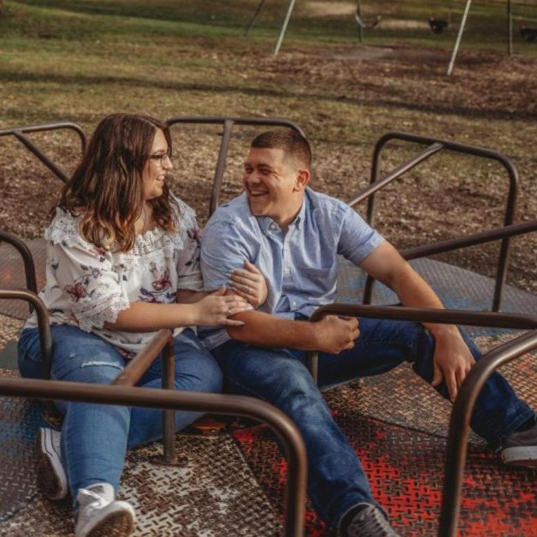 This was the last photo of our engagement shoot. Our photographer saw a playground and wanted to do this. Craig and her spun us around as we all joked around about what 'ifs' like what if we threw up.