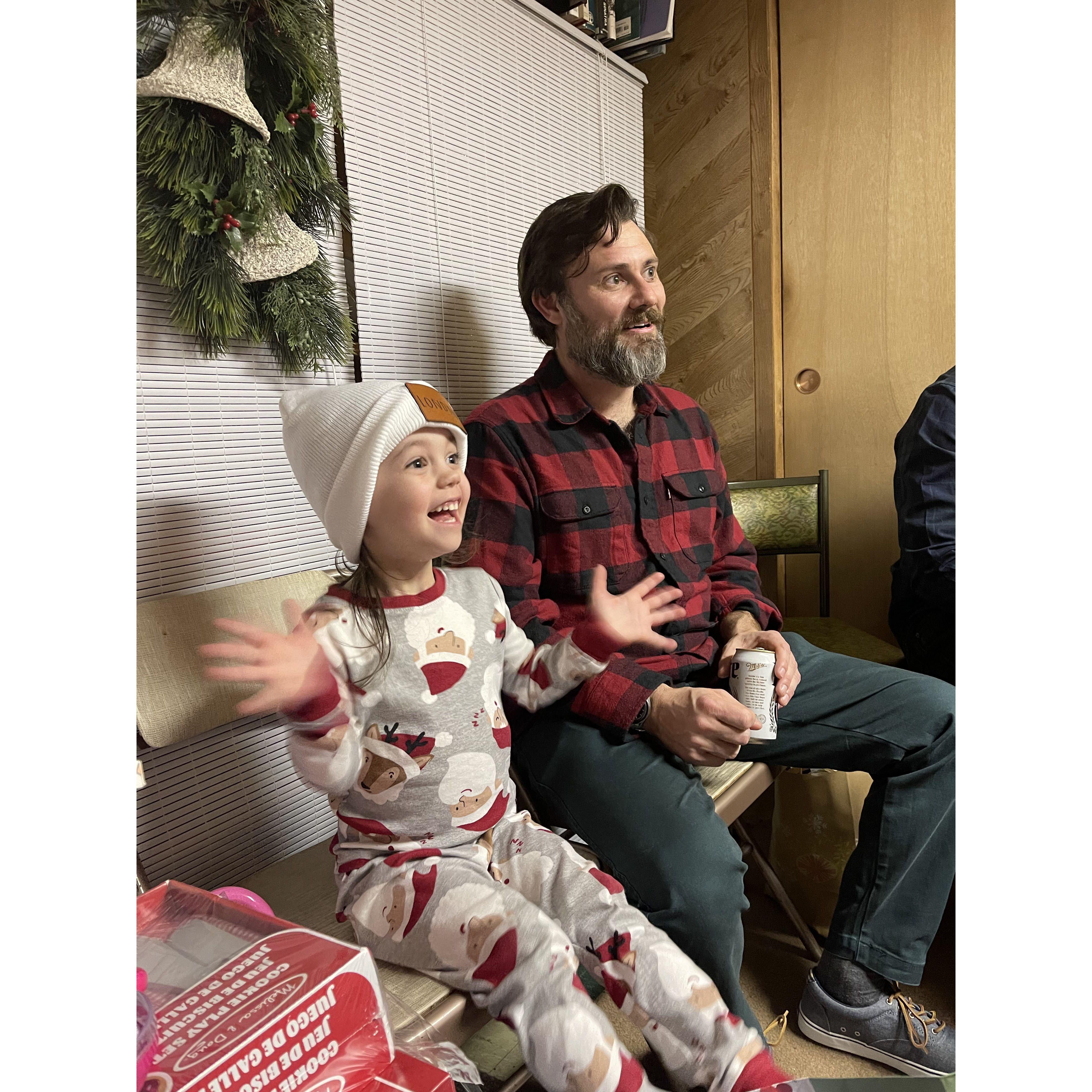 Our niece, Londie-Lu, on Christmas Eve sitting next to her favorite Uncle