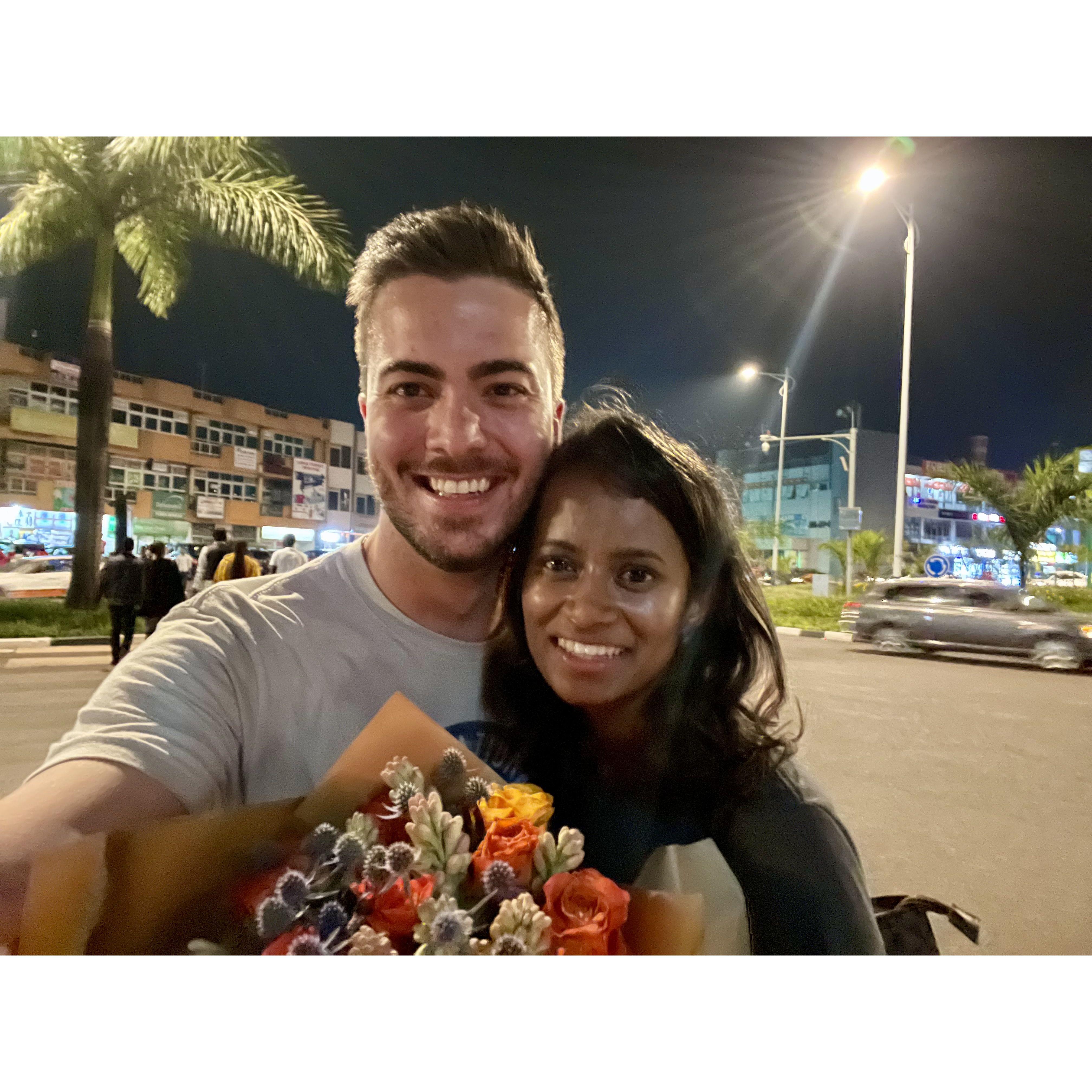 Two MONTHS later: work brings Sharon to Rwanda, Todd hops a flight and shows up at the airport with flowers (the first sign that he may be a keeper)