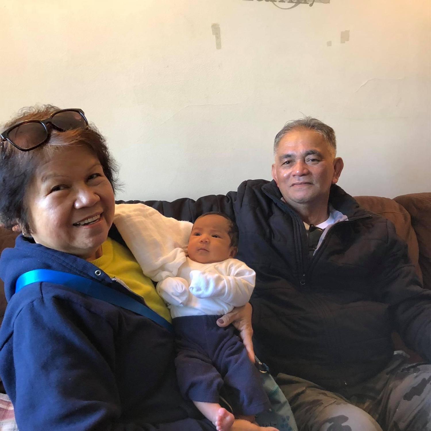 Grandpa and grandma with baby Raena