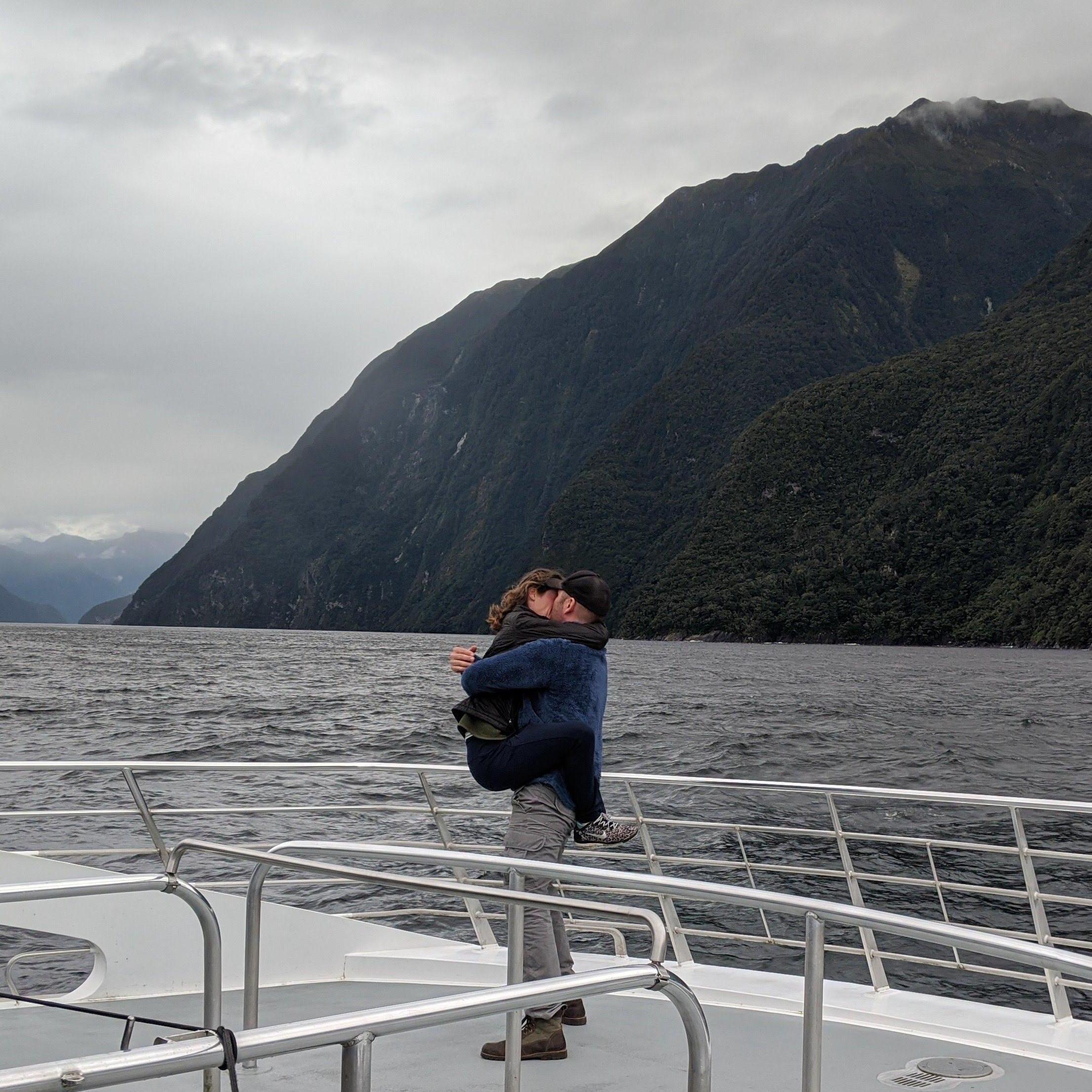 Dan proposed on a rocky boat in the middle of Doubtful Sound in South Island, New Zealand. And, needless to say, Cait was... ecstatic.