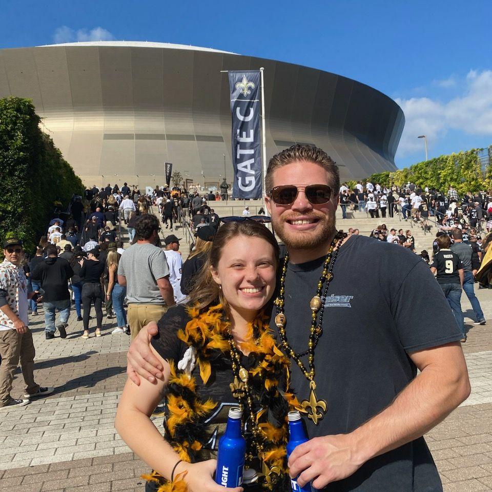 Our first saints game together. We always make room for fun!