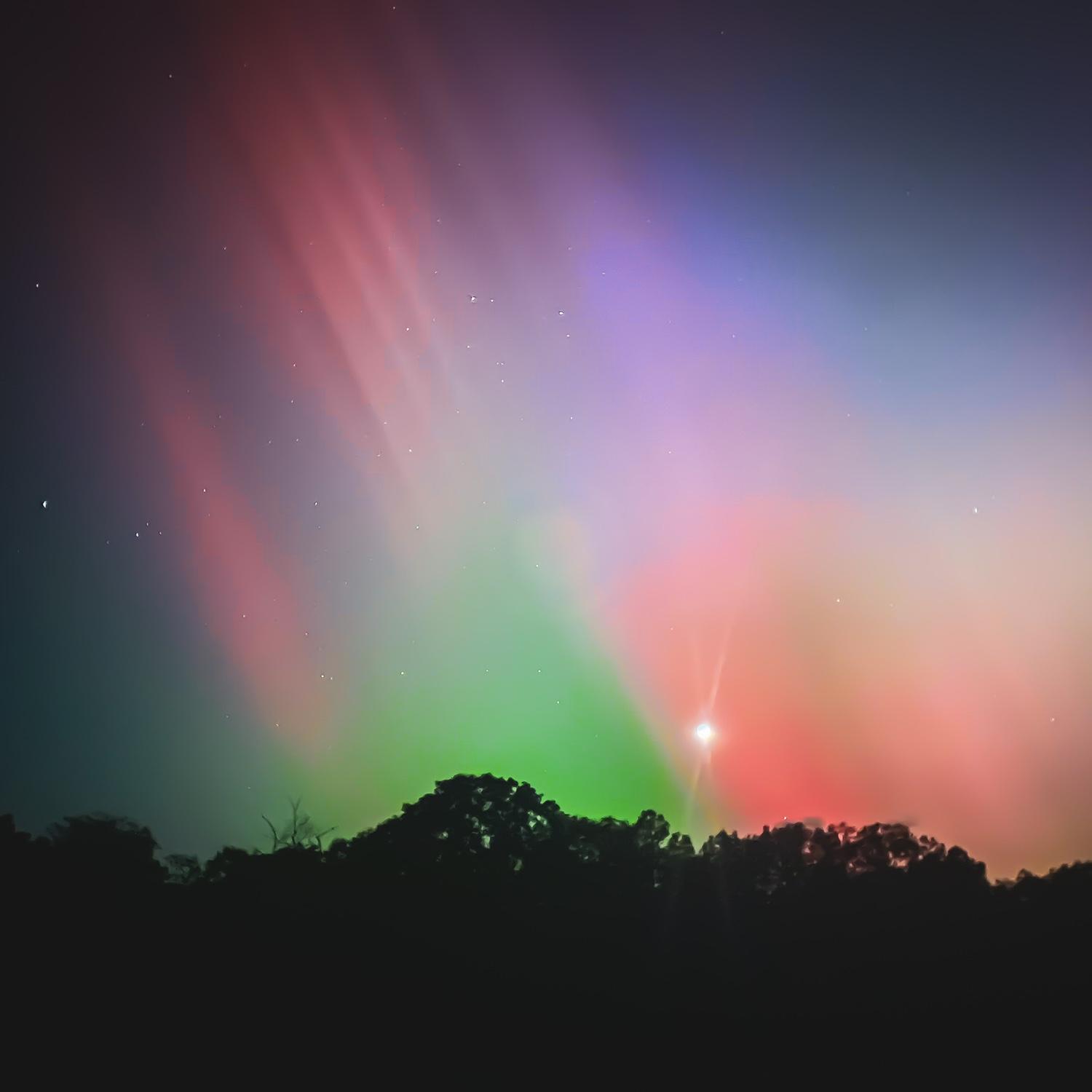 The Aurora Borealis in Raeford, NC. This photo was taken on an iPhone in Ani’s grandparents’ field in their front yard the night before the couple left for Savannah, GA.