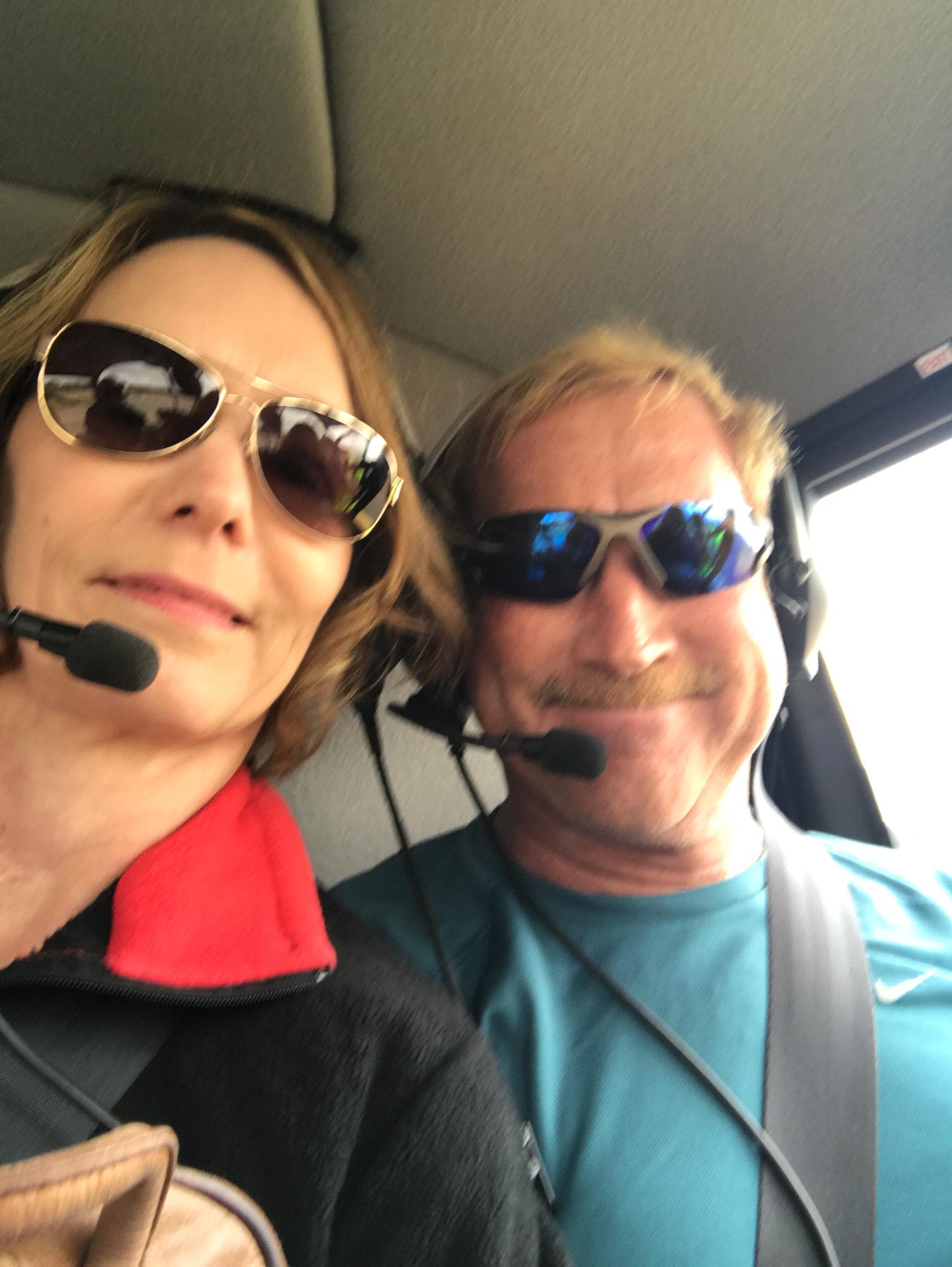 Pilot and co-pilot flying above the mountains in Sedona, AZ