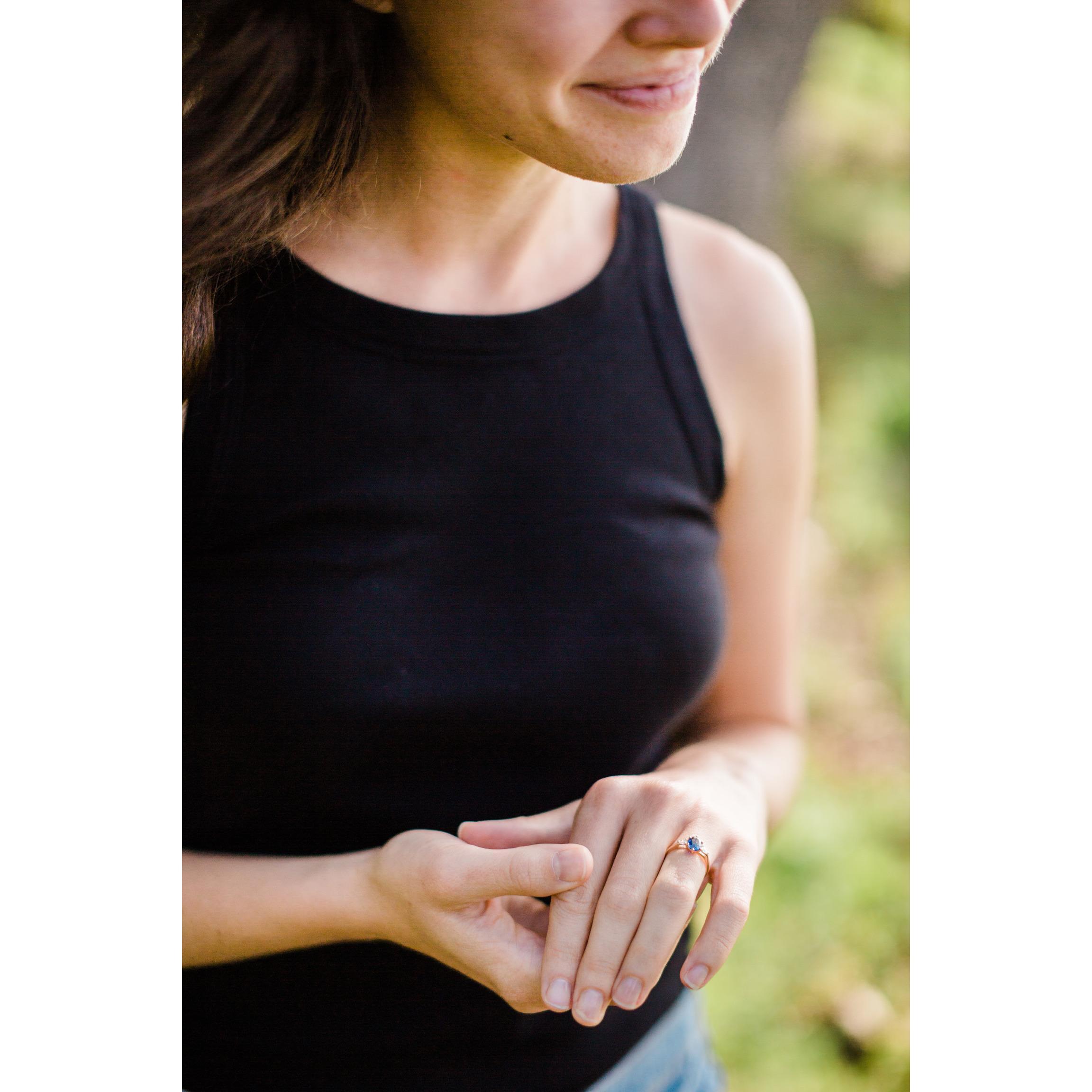The ring was custom made. Per Mishaela's request the central stone is a sapphire, which also happens to be Wes' birthstone.